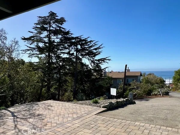 a view of a backyard of the house