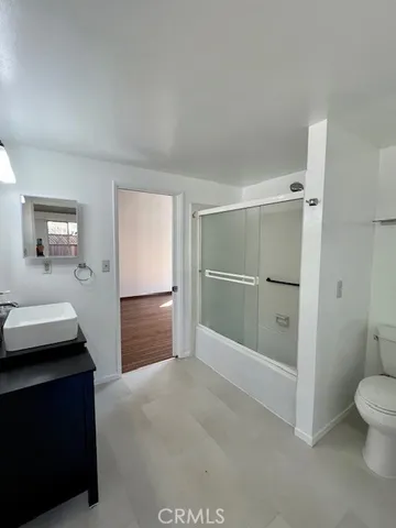 a bathroom with a shower and a toilet