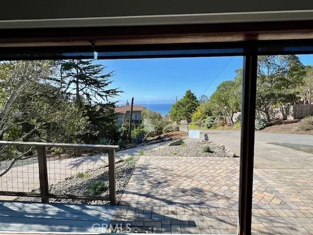 a view of a pathway of a building and small yard