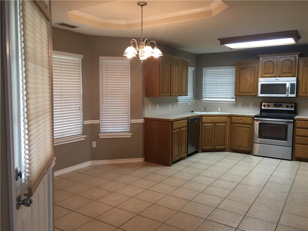 2218 Old Ironsides Road Abilene, TX 79601 - Photo 6 of 26 a kitchen with stainless steel appliances granite countertop a sink and a stove