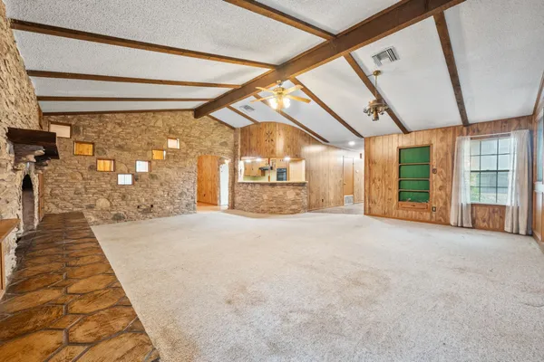 a furnished livingroom with windows