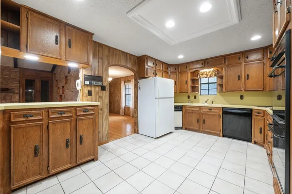 a kitchen with stainless steel appliances granite countertop a sink and cabinets