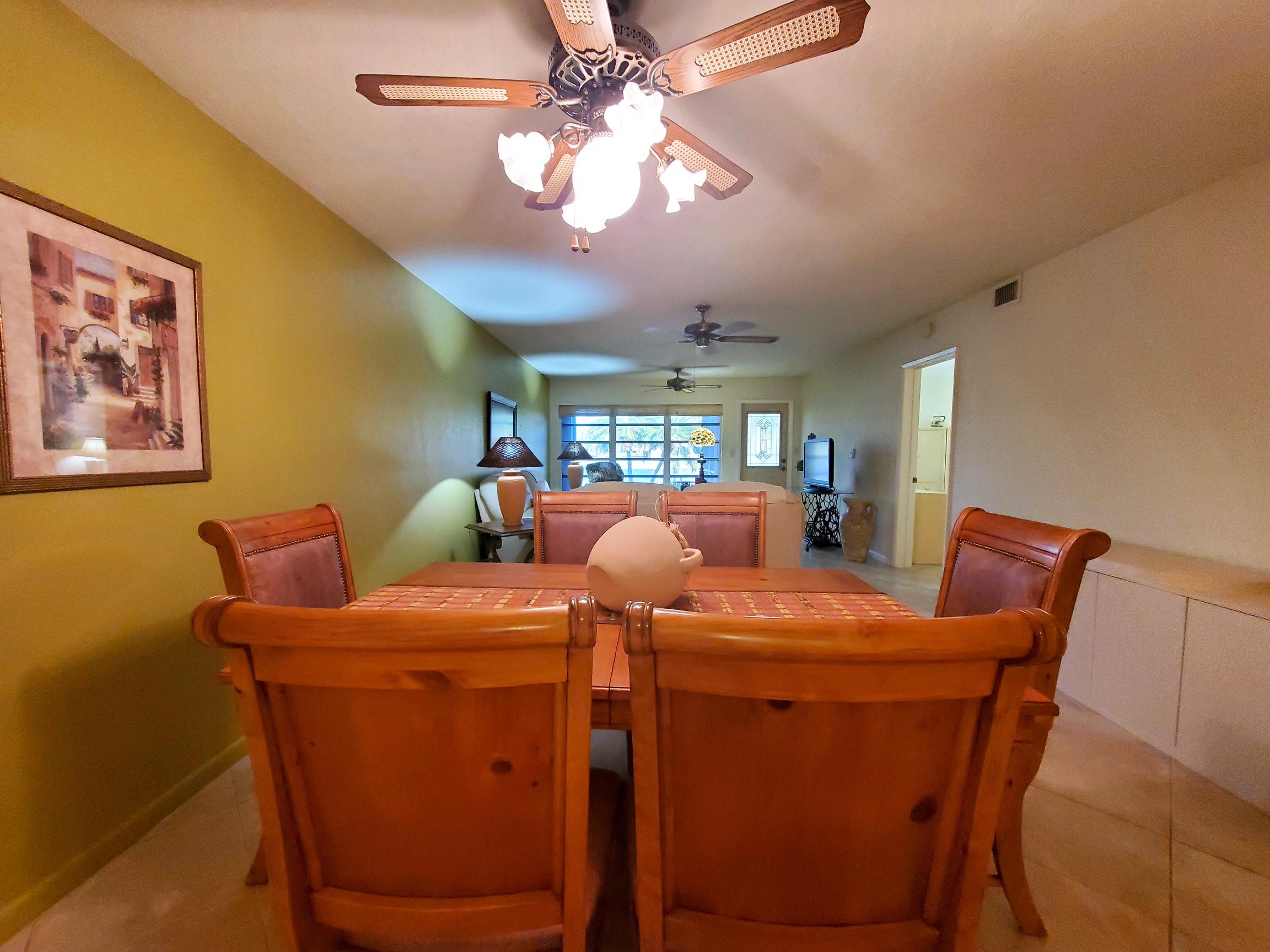 18760 Garbo Terrace, Unit 7 Boca Raton, FL 33496 - Photo 4 of 13 a room with furniture and chandelier