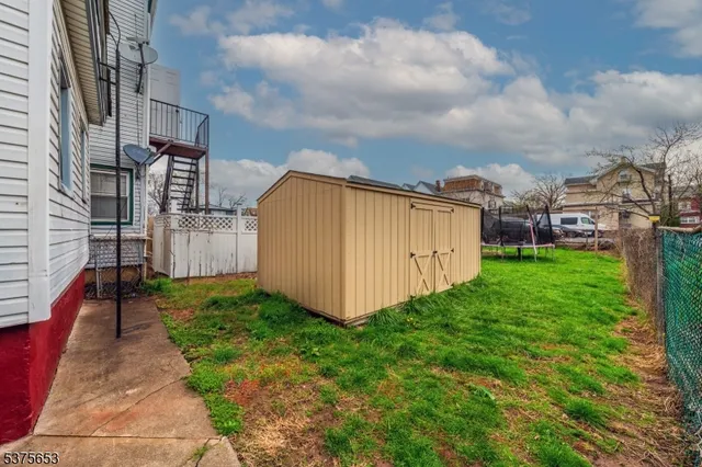 a view of a back yard of the house