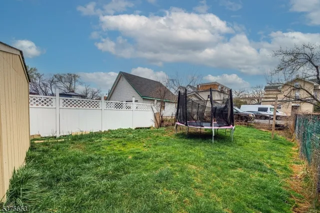 a view of a backyard with sitting area