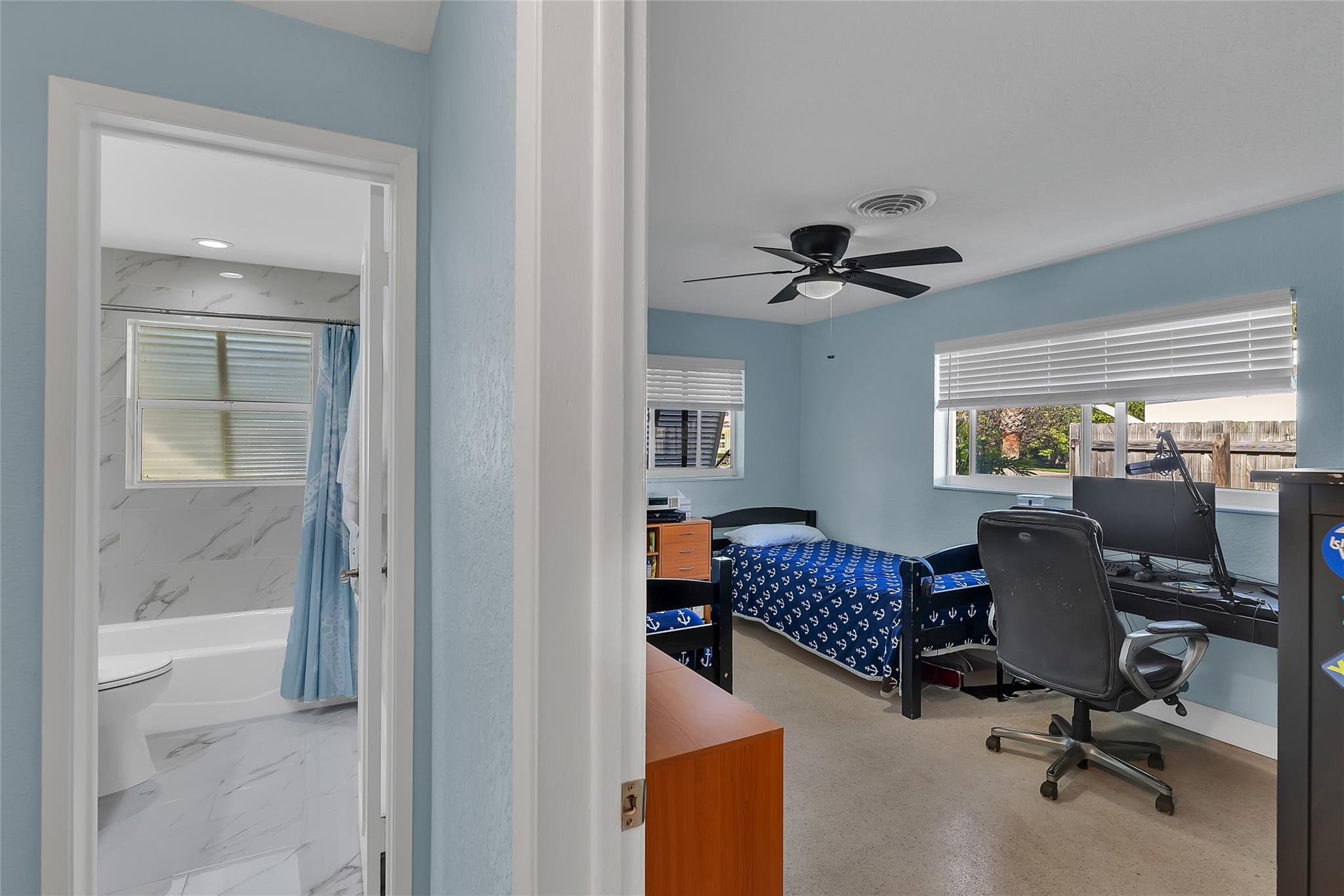 3404 Barton Road Pompano Beach, FL 33062 - Photo 19 of 46 a view of workspace with a window and a chandelier