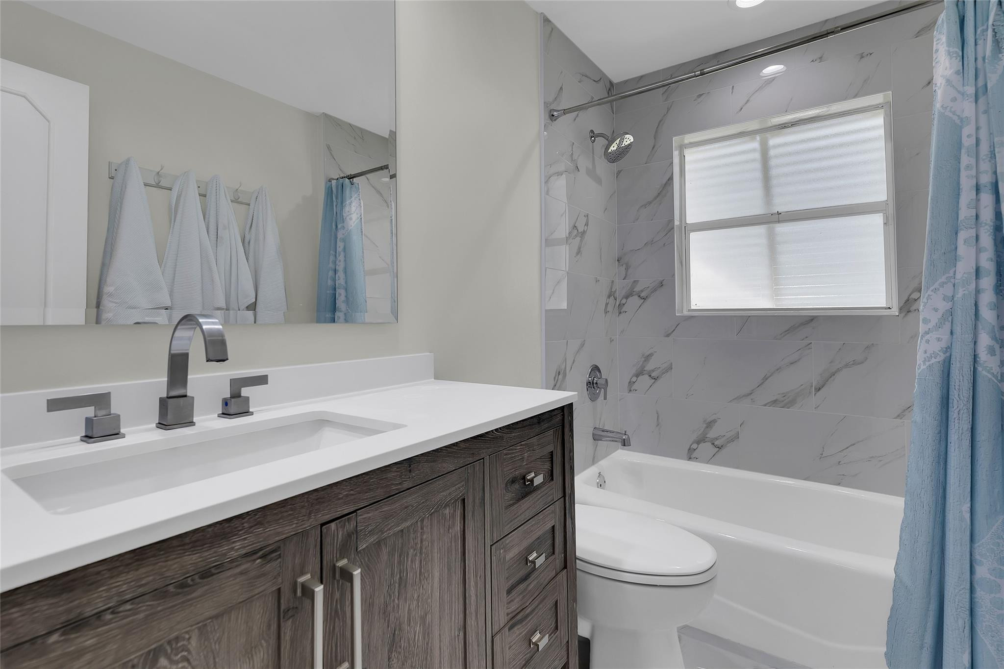 3404 Barton Road Pompano Beach, FL 33062 - Photo 20 of 46 a bathroom with a granite countertop sink toilet and shower