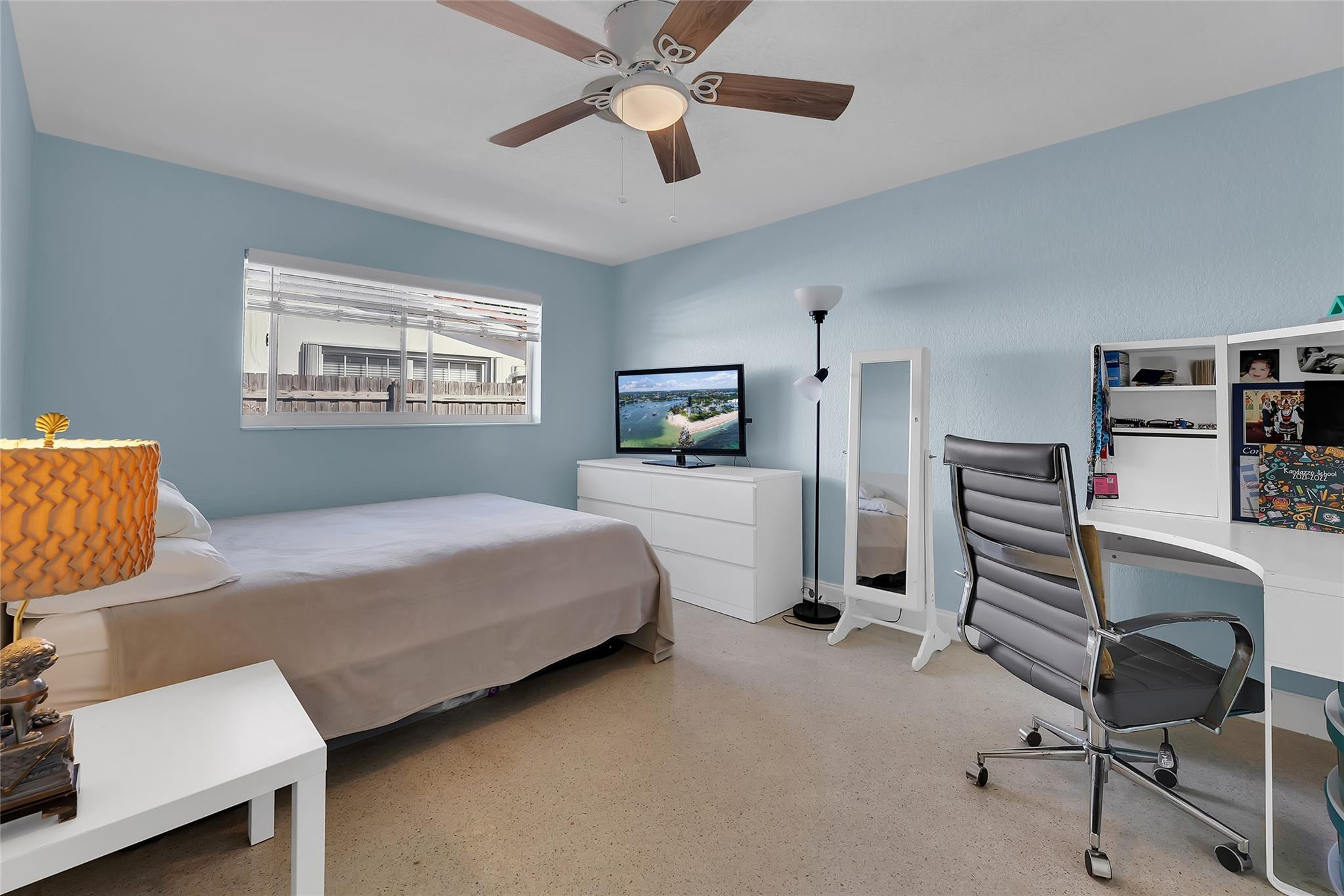 3404 Barton Road Pompano Beach, FL 33062 - Photo 23 of 46 a bedroom with a bed and a chandelier