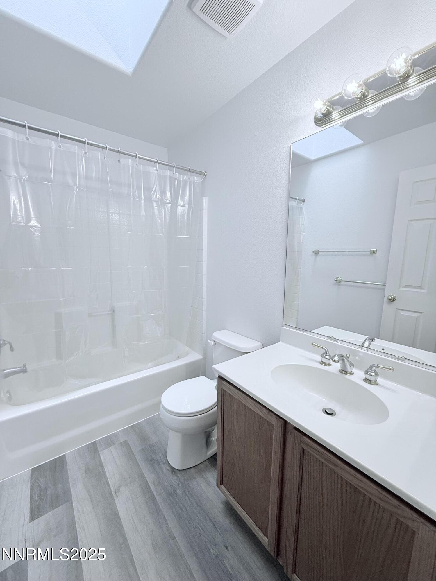7539 Michaela Drive Reno, NV 89511 - Photo 13 of 33 a bathroom with a sink a toilet and a bathtub