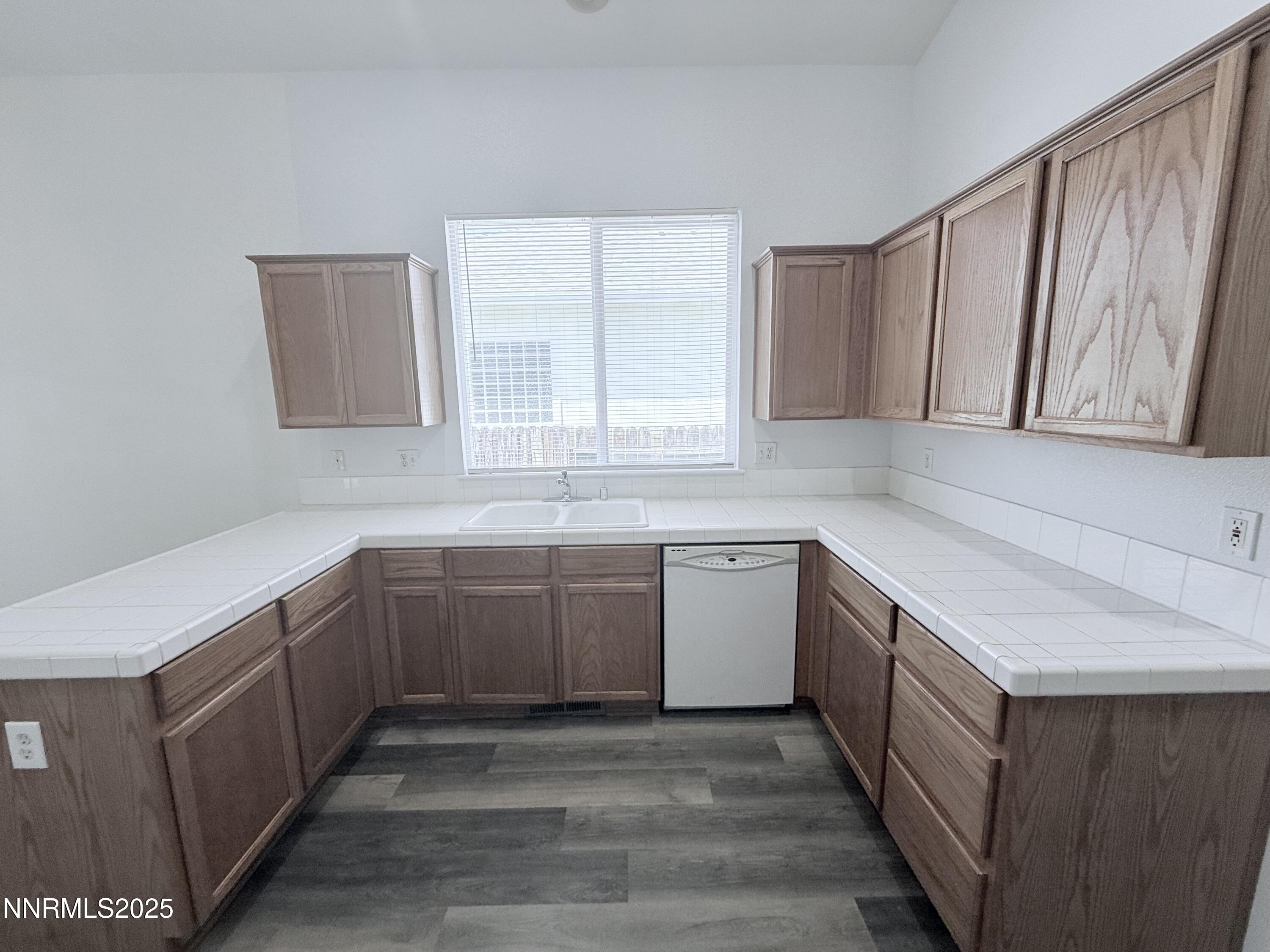 7539 Michaela Drive Reno, NV 89511 - Photo 16 of 33 a kitchen with sink cabinets and window