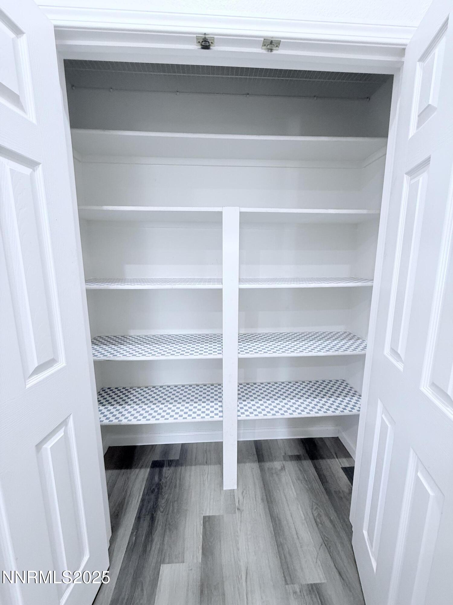 7539 Michaela Drive Reno, NV 89511 - Photo 18 of 33 a view of walk in closet with empty racks