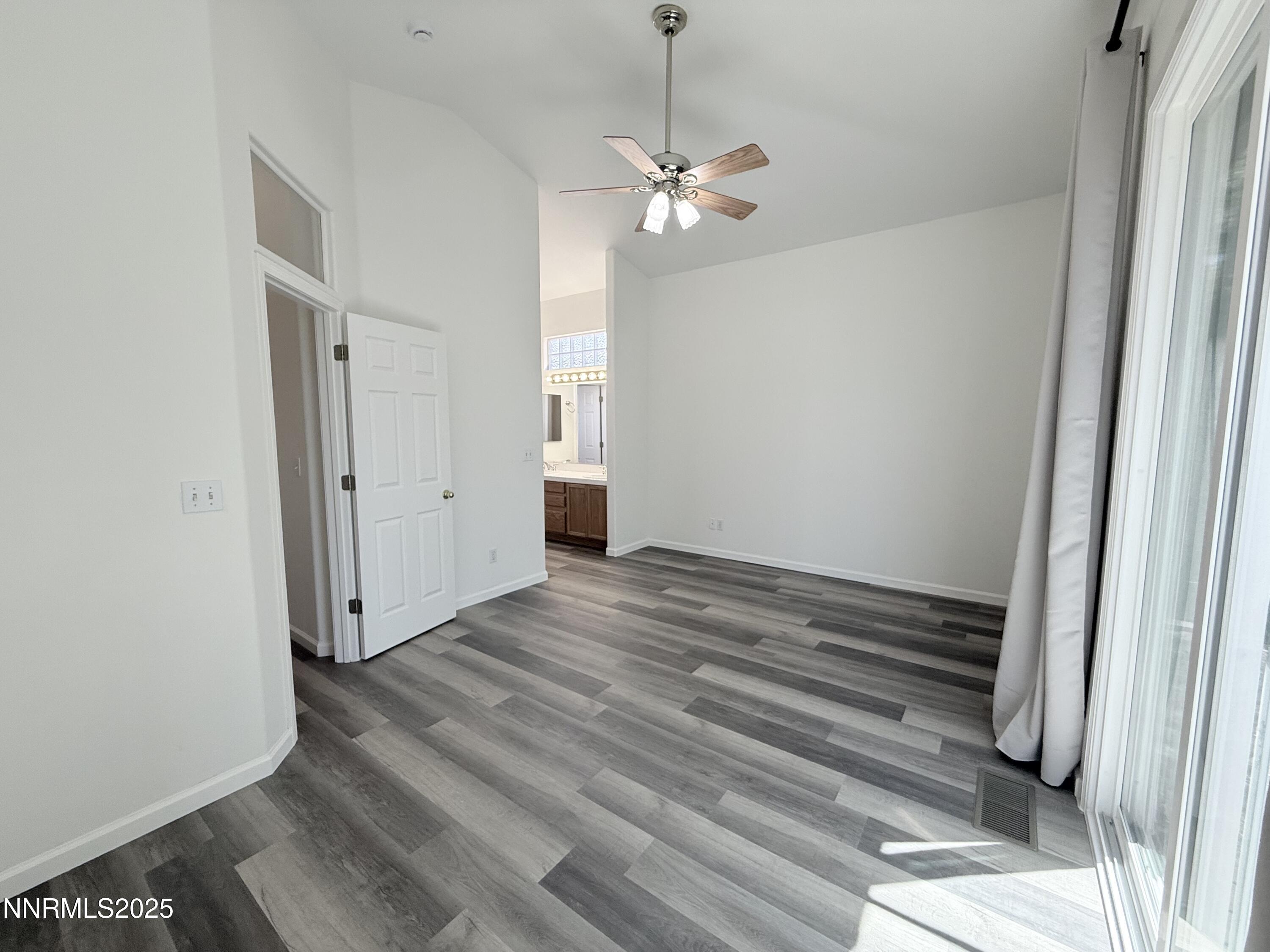 7539 Michaela Drive Reno, NV 89511 - Photo 21 of 33 a view of a livingroom with wooden floor