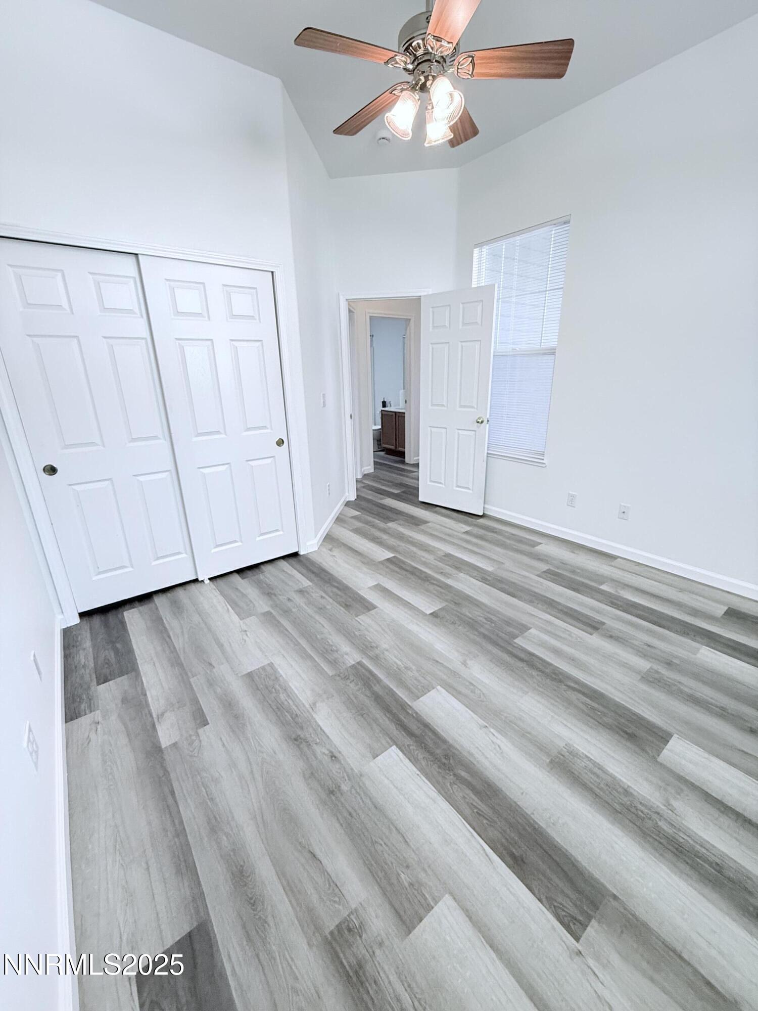 7539 Michaela Drive Reno, NV 89511 - Photo 28 of 33 a view of a livingroom with wooden floor and closet area