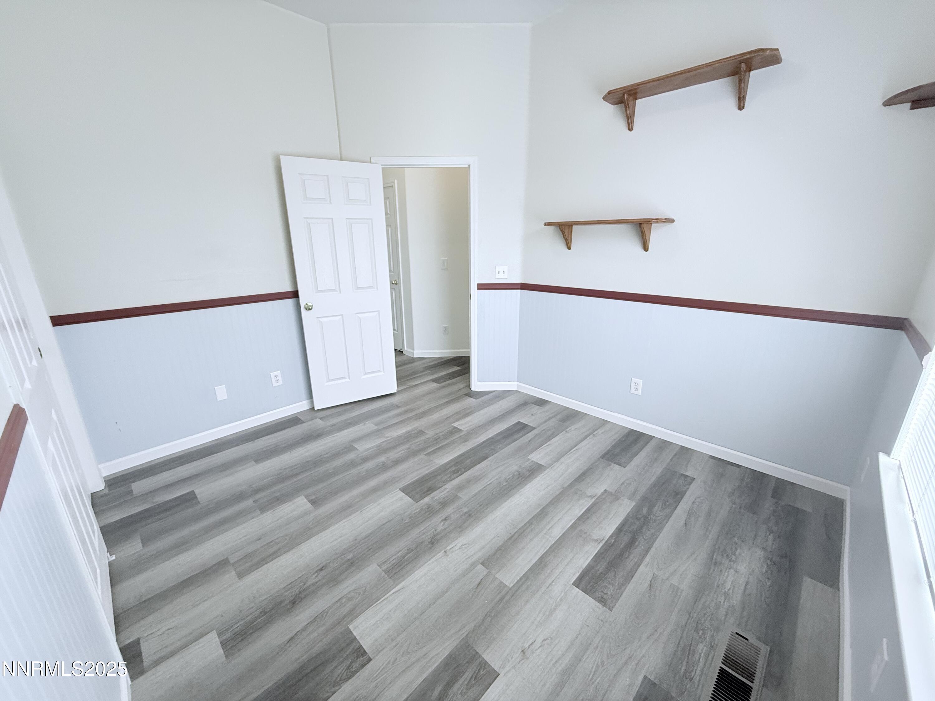 7539 Michaela Drive Reno, NV 89511 - Photo 30 of 33 a view of a room with wooden floor