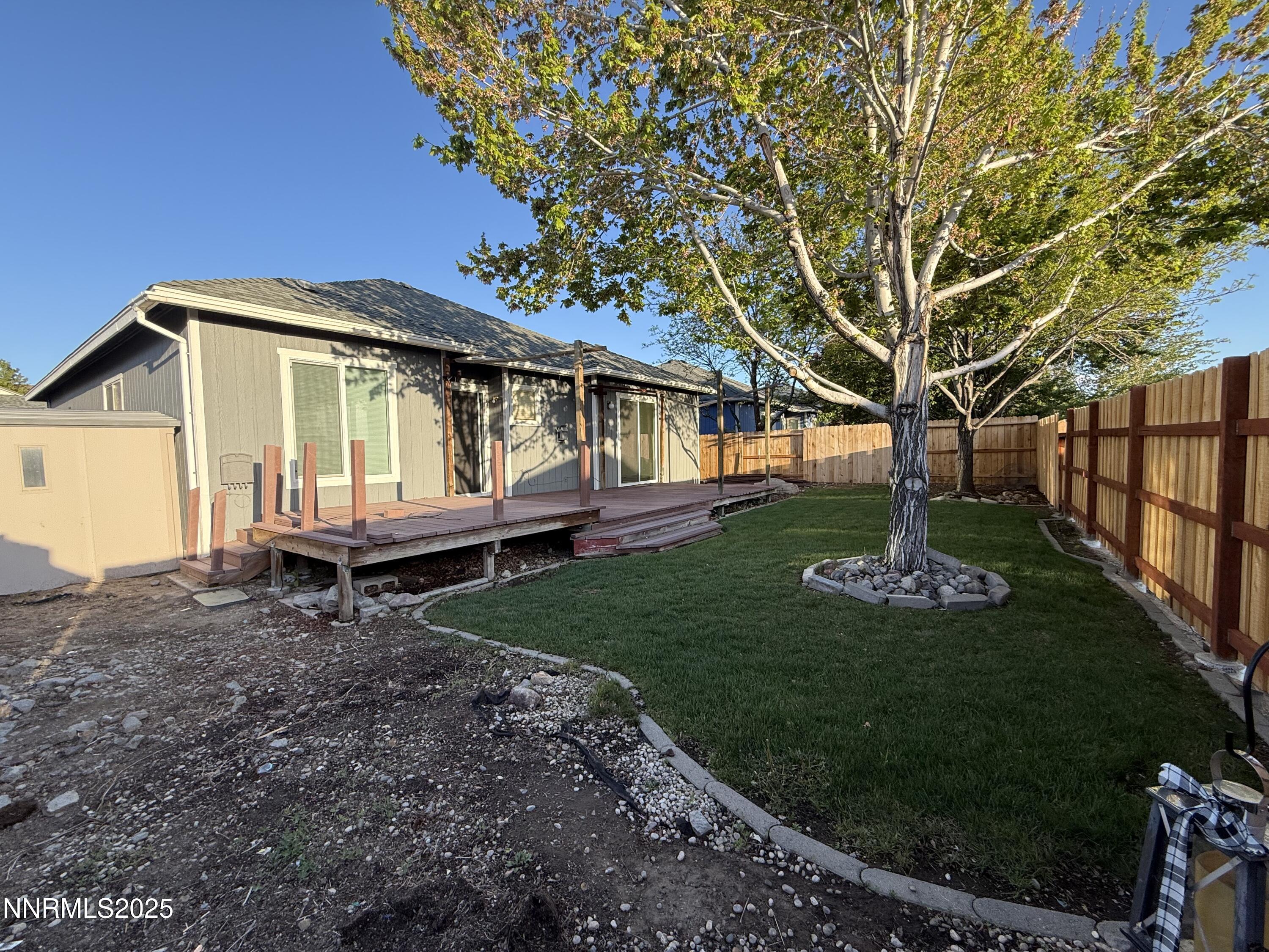 7539 Michaela Drive Reno, NV 89511 - Photo 32 of 33 a front view of a house with a garden
