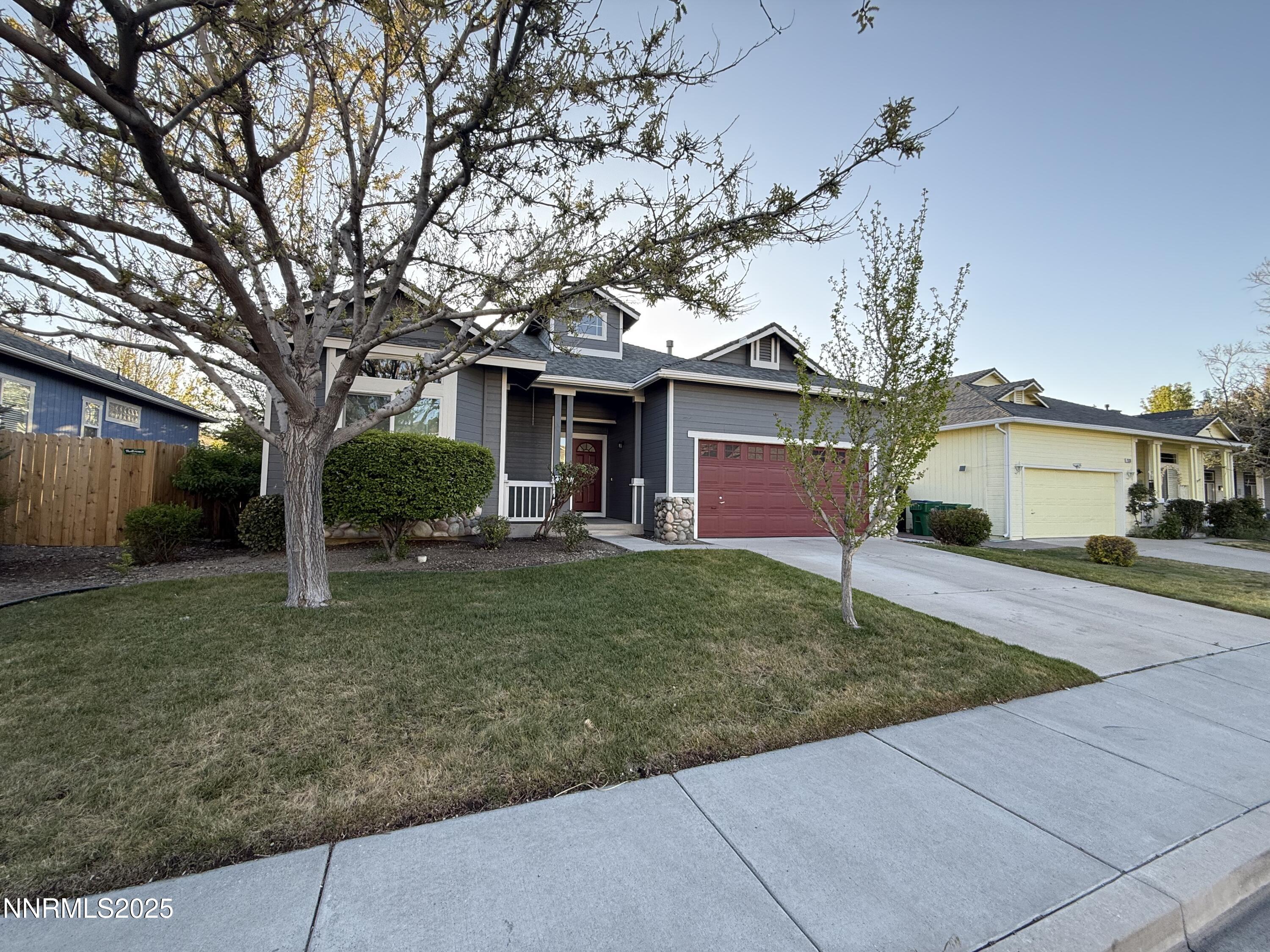 7539 Michaela Drive Reno, NV 89511 - Photo 4 of 33 front view of a house with a yard
