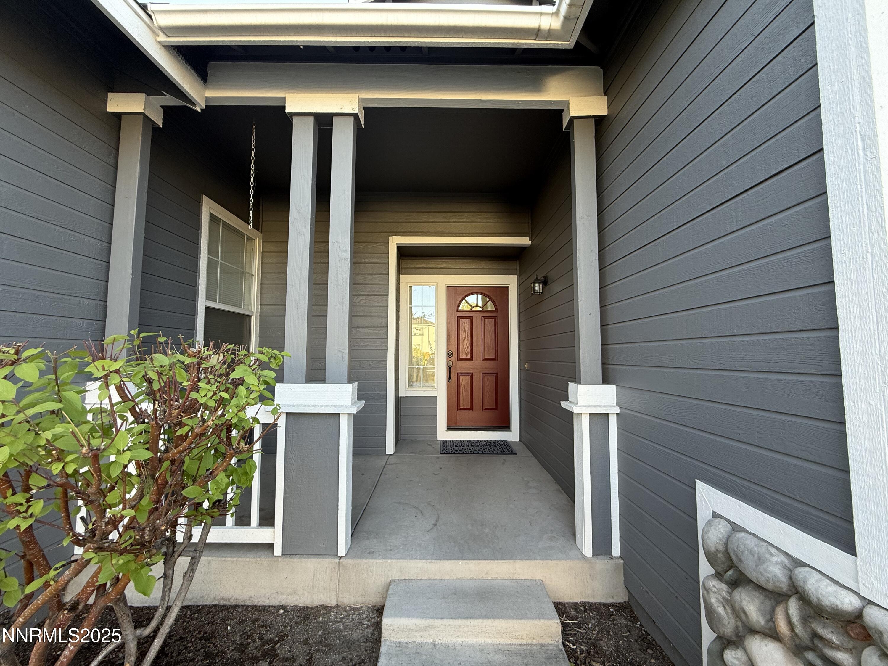 7539 Michaela Drive Reno, NV 89511 - Photo 6 of 33 a view of a entryway door front of house