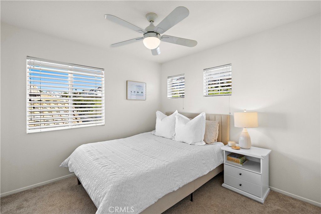 23 Cassis Dana Point, CA 92629 - Photo 13 of 19 a bedroom with a large bed and a window