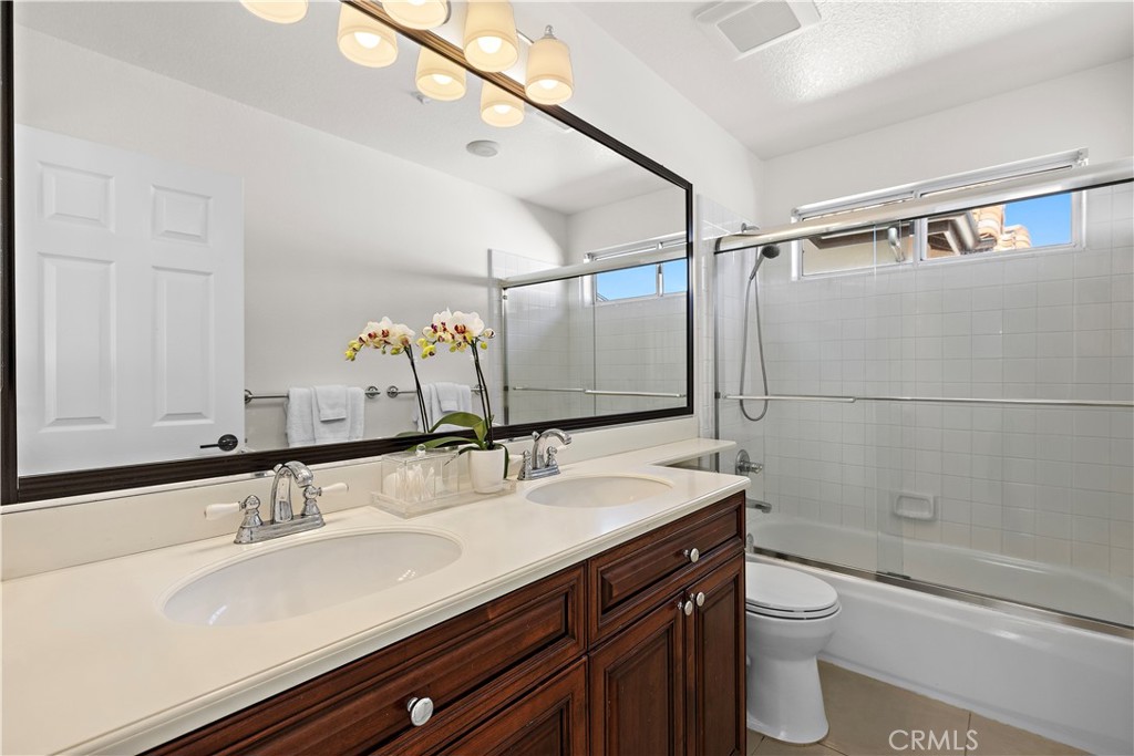 23 Cassis Dana Point, CA 92629 - Photo 14 of 19 a bathroom with a sink and a mirror