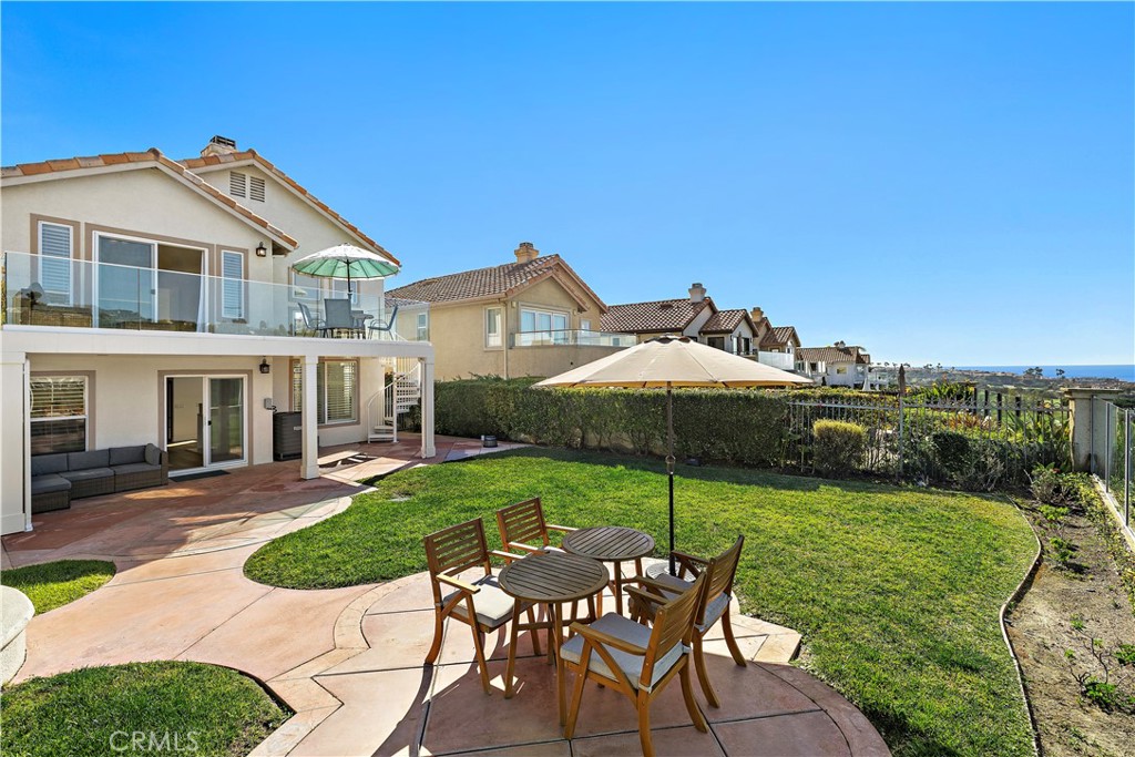 23 Cassis Dana Point, CA 92629 - Photo 17 of 19 a view of a house with backyard sitting area and garden