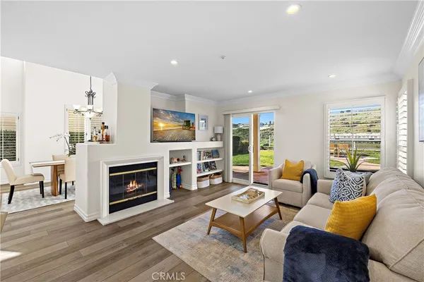 a living room with furniture flat screen tv and a fireplace