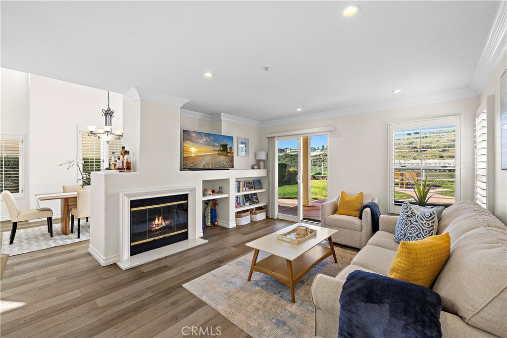 23 Cassis Dana Point, CA 92629 - Photo 5 of 19 a living room with furniture flat screen tv and a fireplace