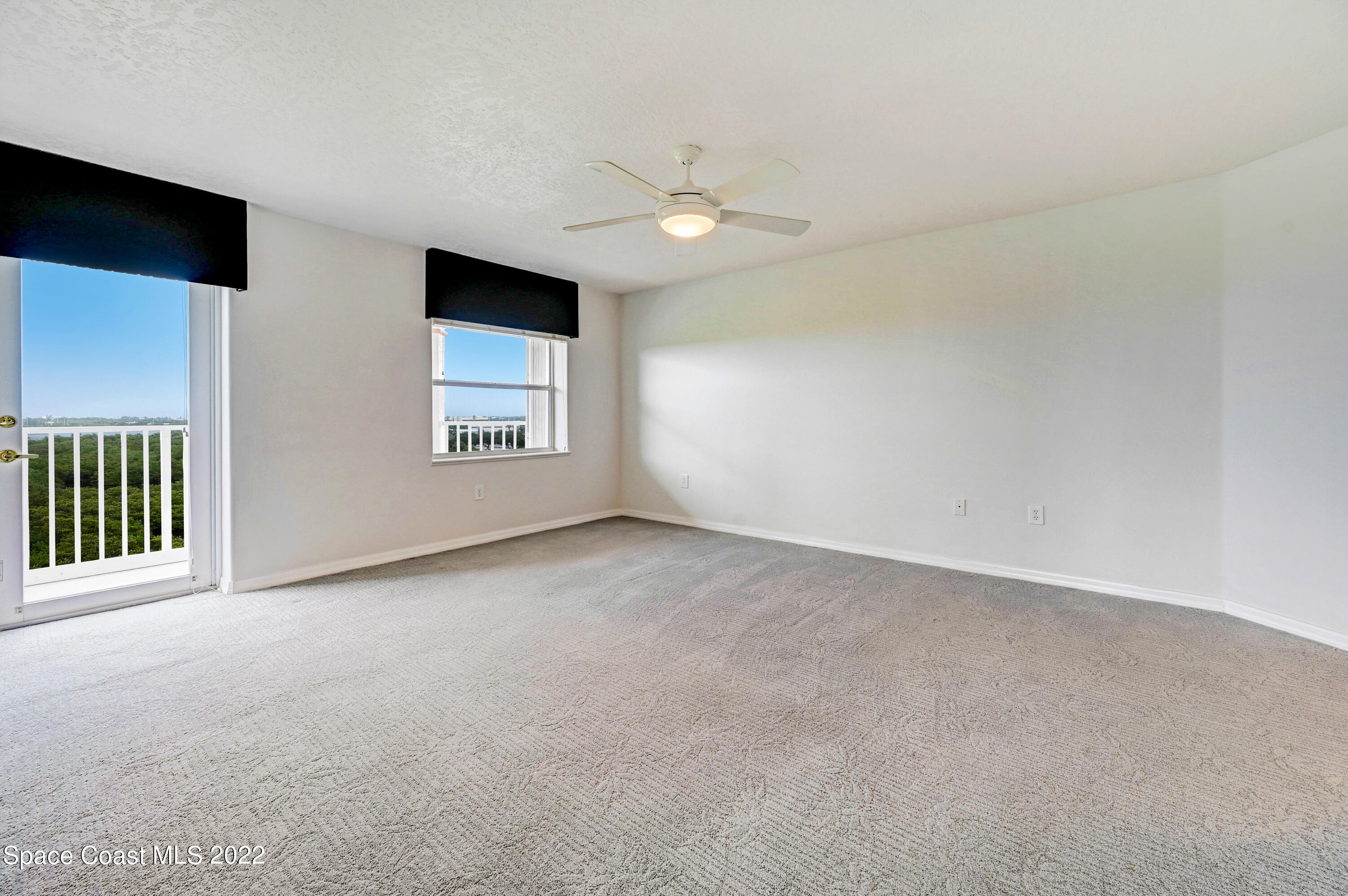 801 Del Rio Way, Unit 602 Merritt Island, FL 32953 - Photo 14 of 36 a view of an empty room with a window