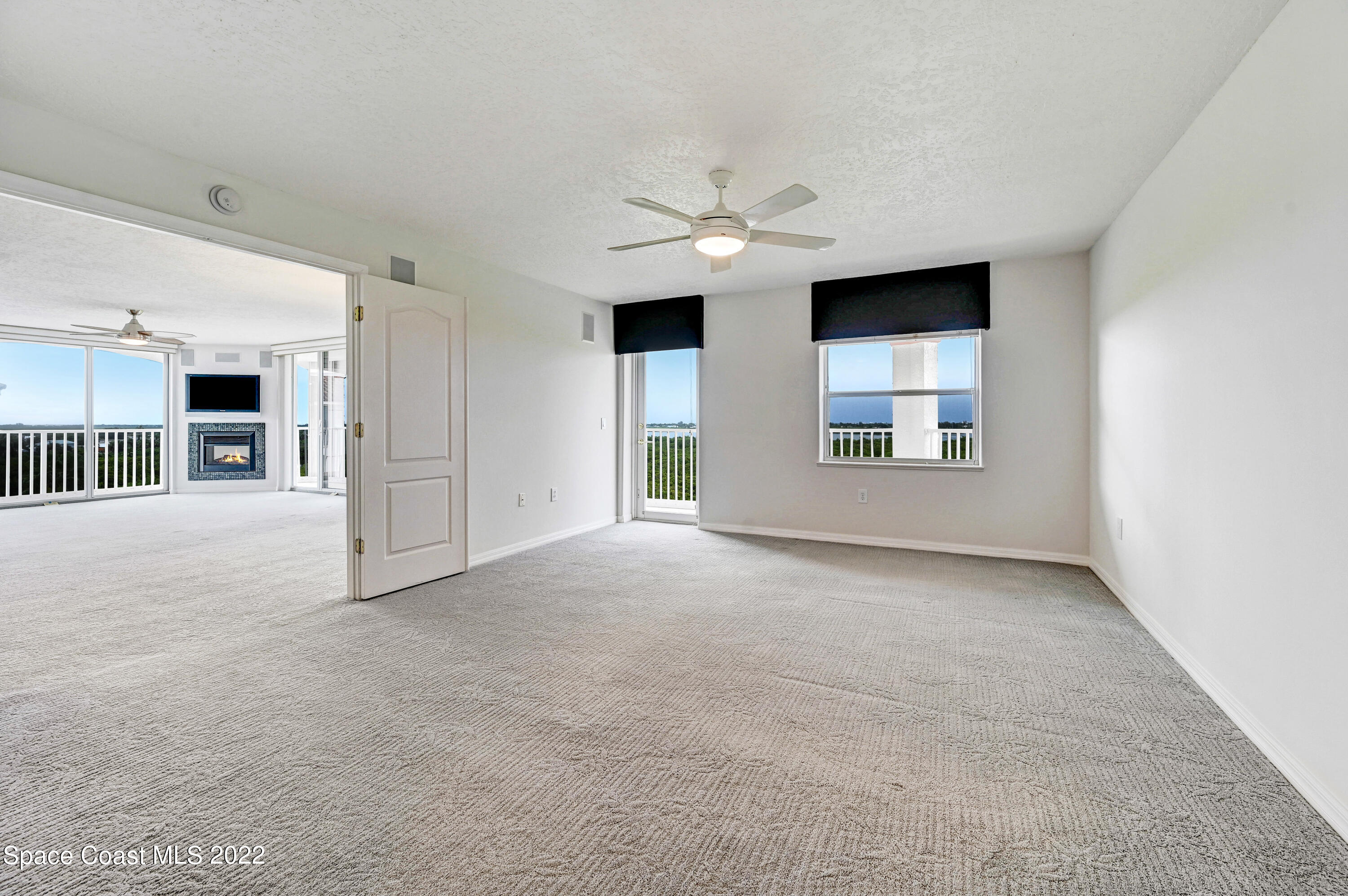 801 Del Rio Way, Unit 602 Merritt Island, FL 32953 - Photo 15 of 36 a view of a house with an empty space and windows