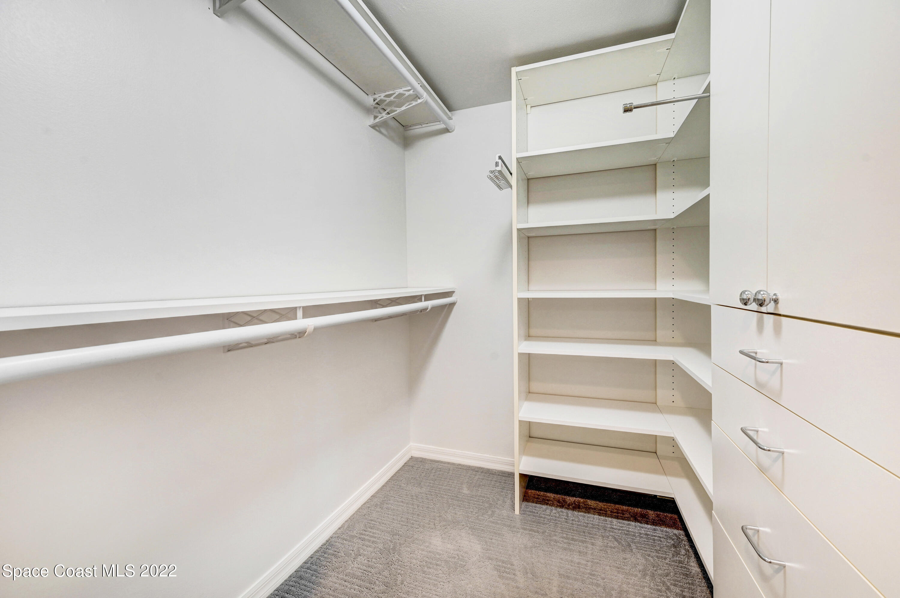 801 Del Rio Way, Unit 602 Merritt Island, FL 32953 - Photo 18 of 36 a view of an empty walk in closet