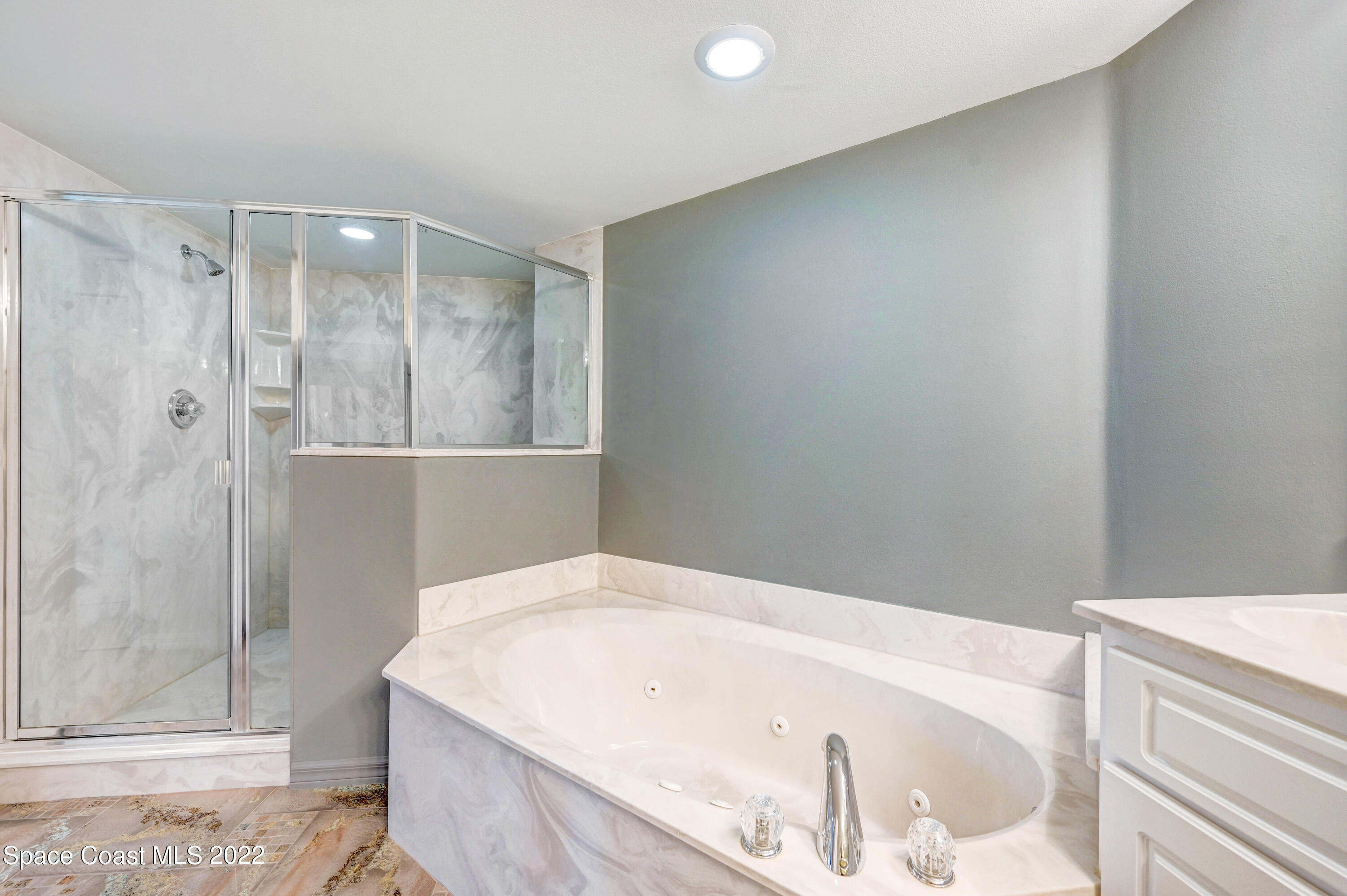 801 Del Rio Way, Unit 602 Merritt Island, FL 32953 - Photo 19 of 36 a bathroom with a bathtub and a shower