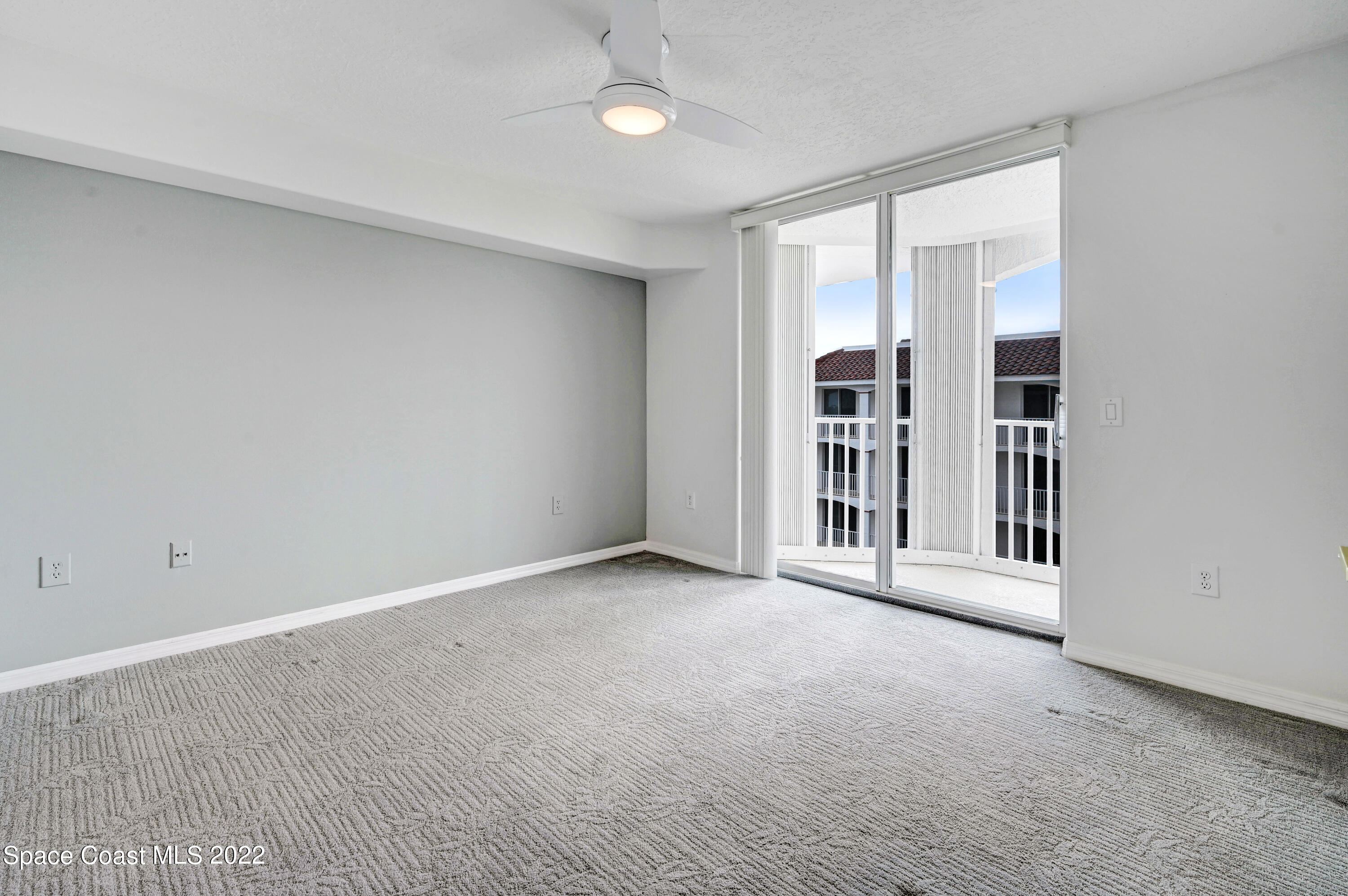 801 Del Rio Way, Unit 602 Merritt Island, FL 32953 - Photo 23 of 36 a view of an empty room with a window