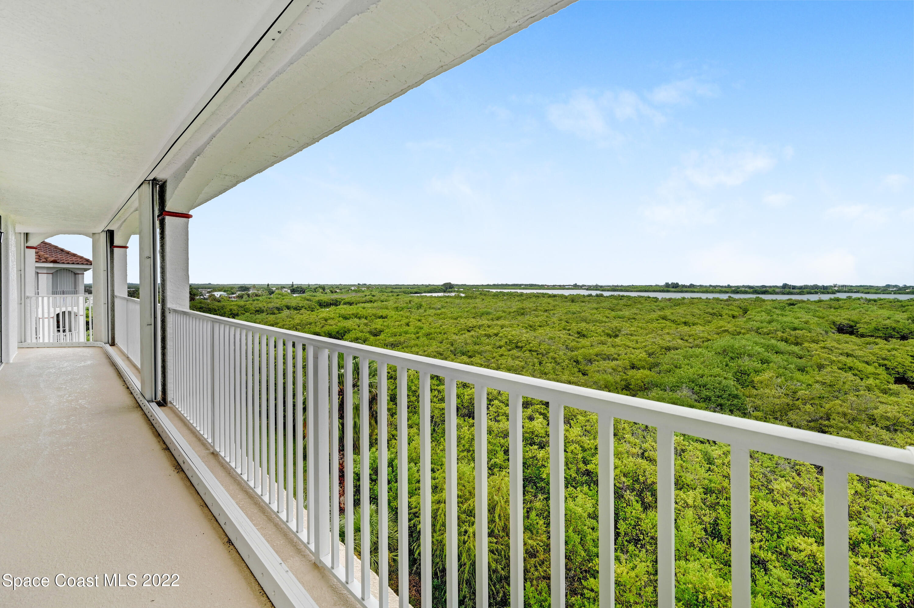 801 Del Rio Way, Unit 602 Merritt Island, FL 32953 - Photo 26 of 36 a balcony with an outdoor space