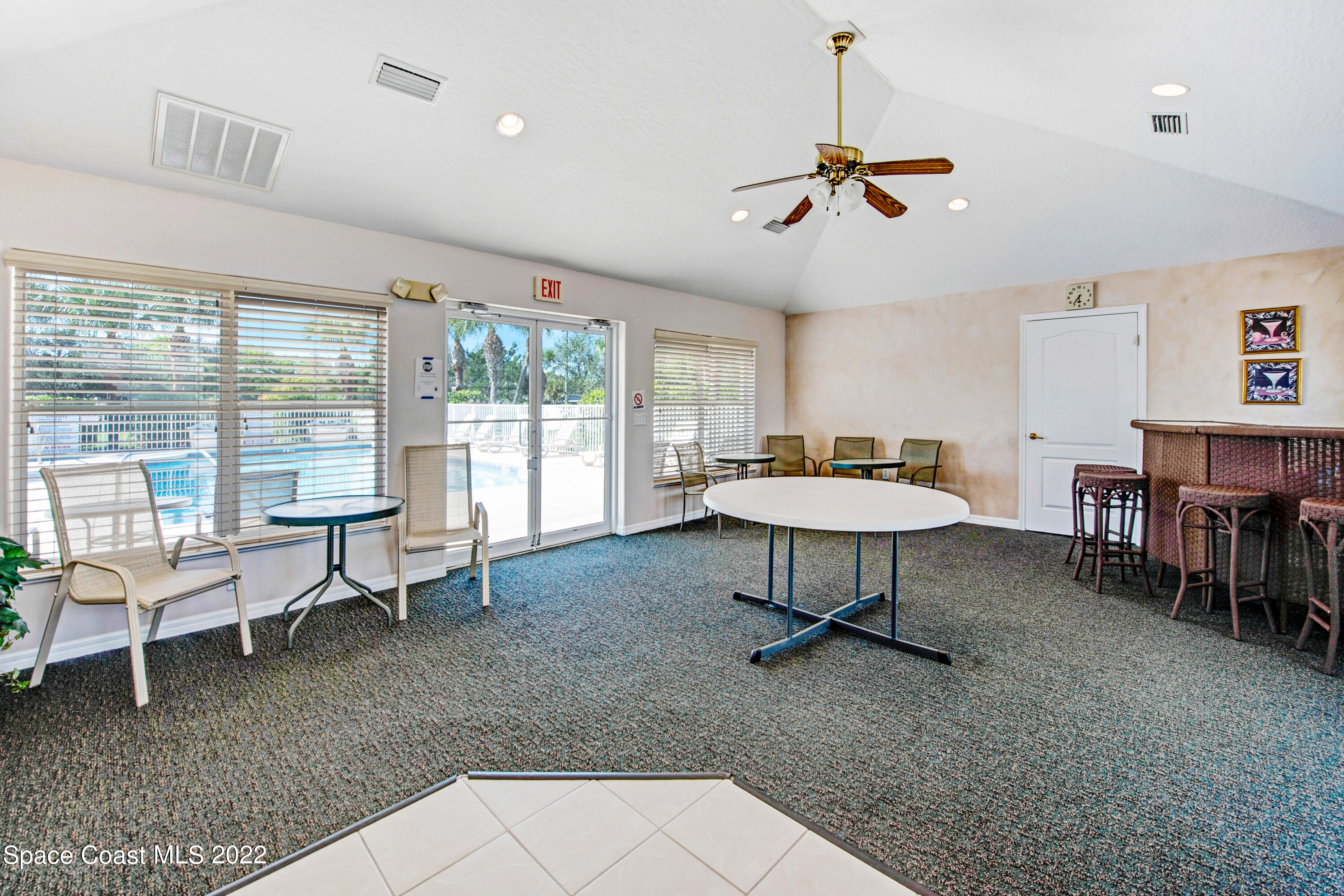 801 Del Rio Way, Unit 602 Merritt Island, FL 32953 - Photo 29 of 36 a living room with furniture and a large window