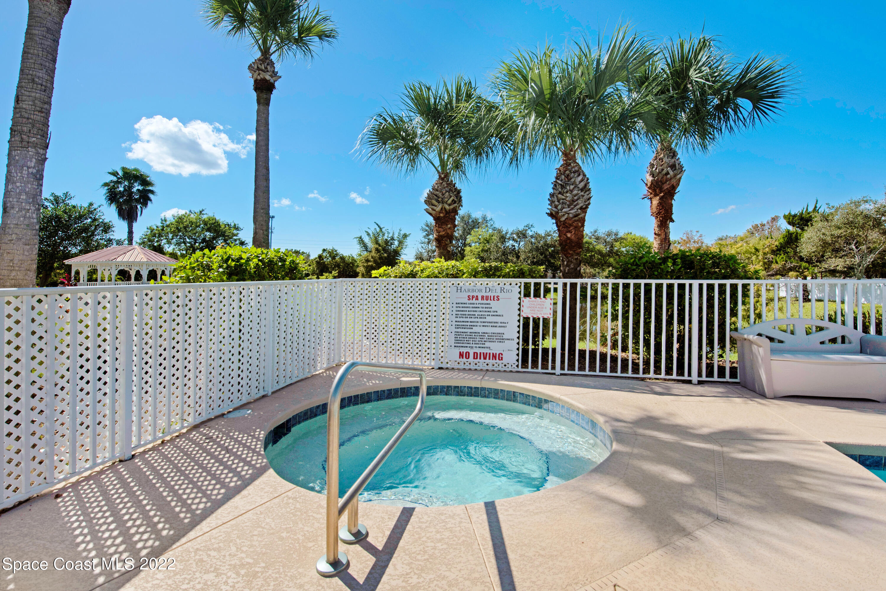 801 Del Rio Way, Unit 602 Merritt Island, FL 32953 - Photo 32 of 36 a view of a terrace with a bench