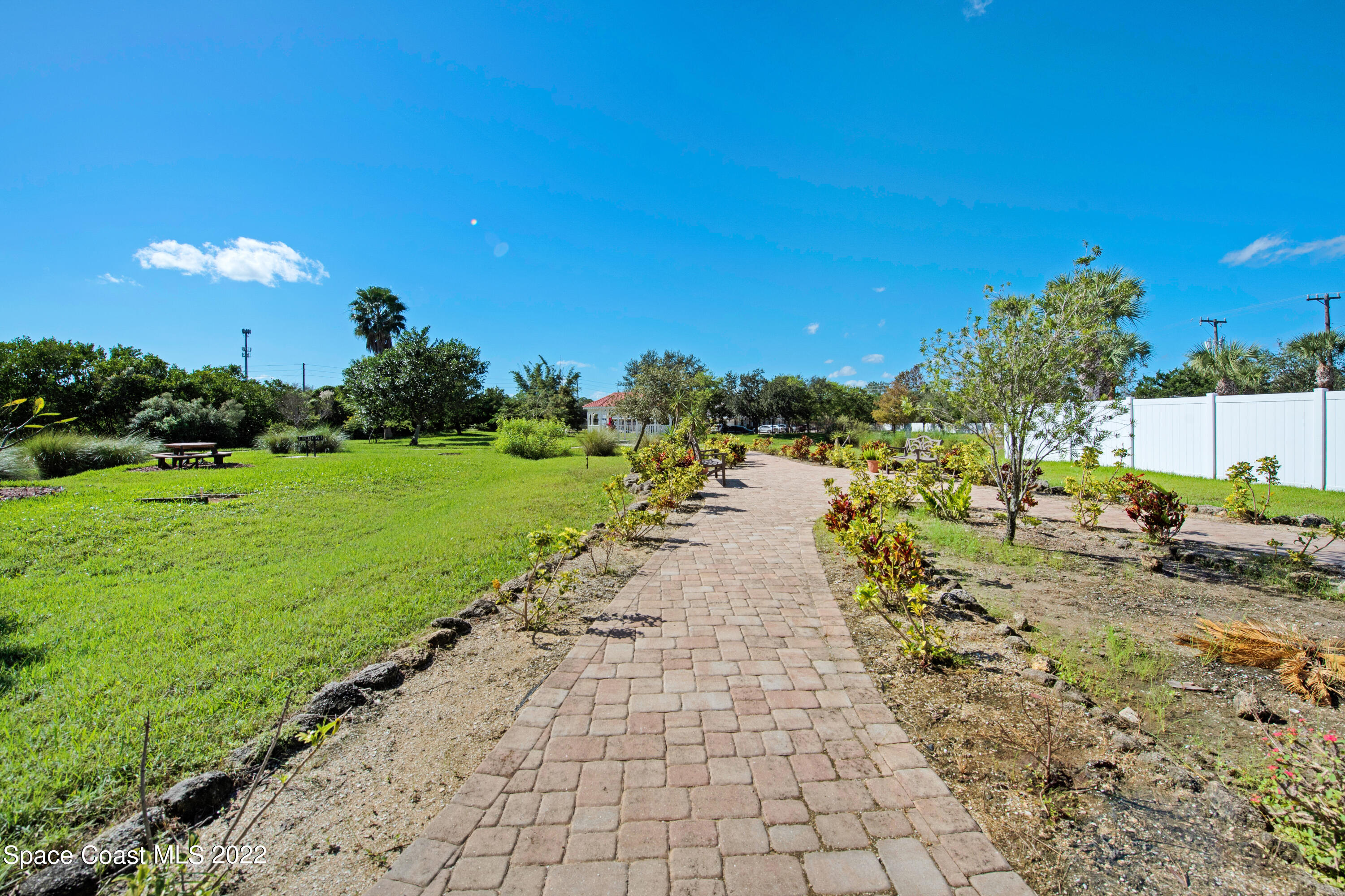 801 Del Rio Way, Unit 602 Merritt Island, FL 32953 - Photo 34 of 36 a view of a yard with plants