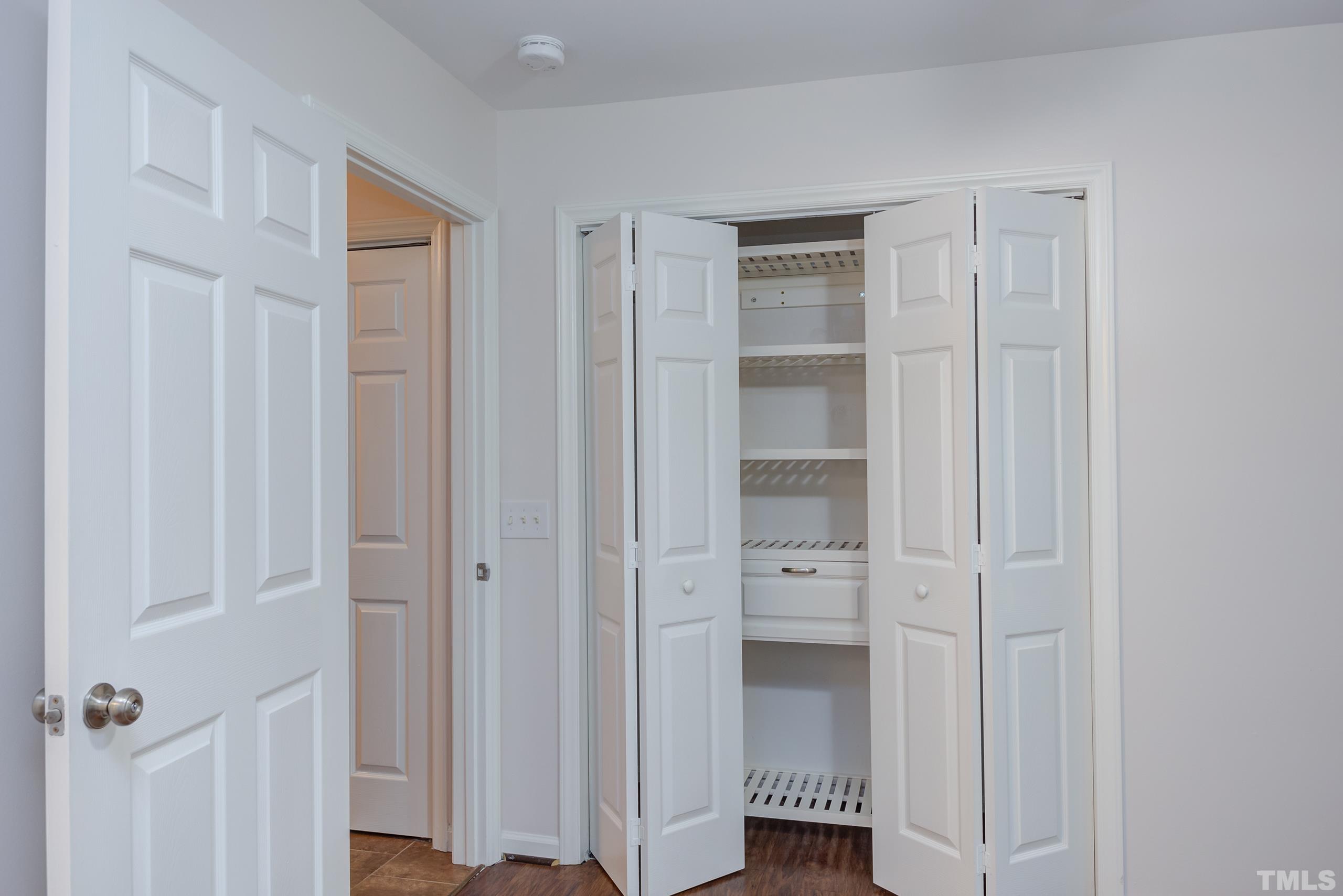 2801 Trailwood Pines Lane, Unit 102 Raleigh, NC 27603 - Photo 19 of 27 a view of walk in closet with empty racks