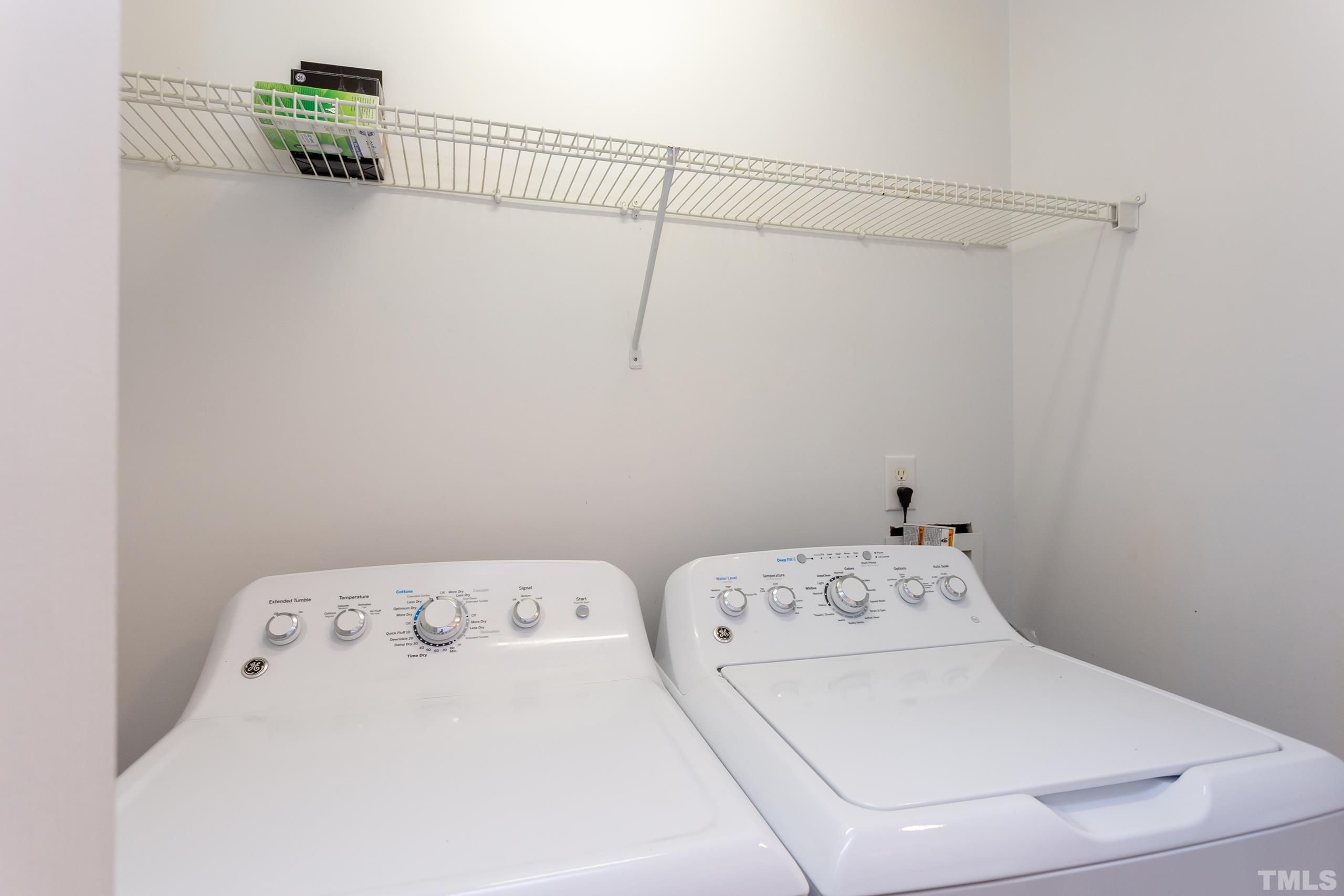 2801 Trailwood Pines Lane, Unit 102 Raleigh, NC 27603 - Photo 22 of 27 a utility room with dryer and washer