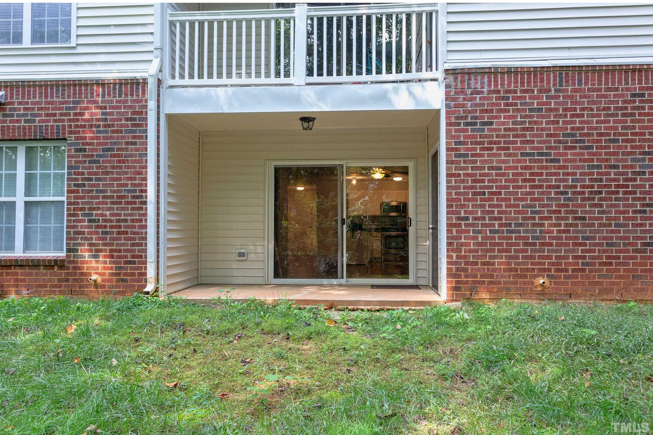2801 Trailwood Pines Lane, Unit 102 Raleigh, NC 27603 - Photo 26 of 27 a brick house with a large window