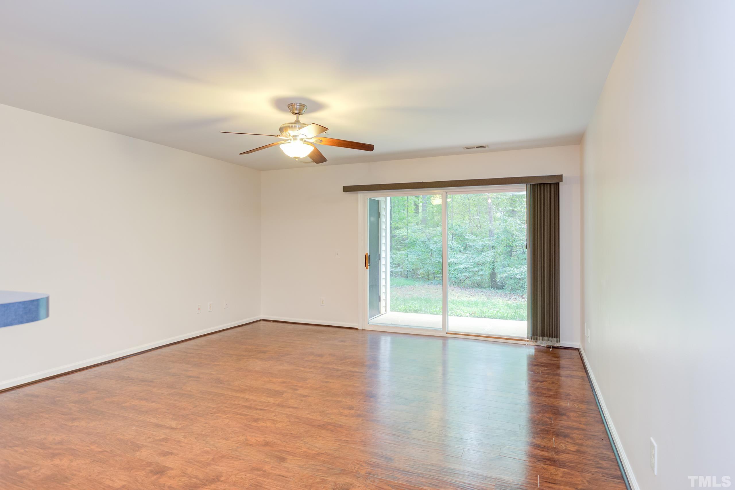 2801 Trailwood Pines Lane, Unit 102 Raleigh, NC 27603 - Photo 5 of 27 a view of an empty room with a window