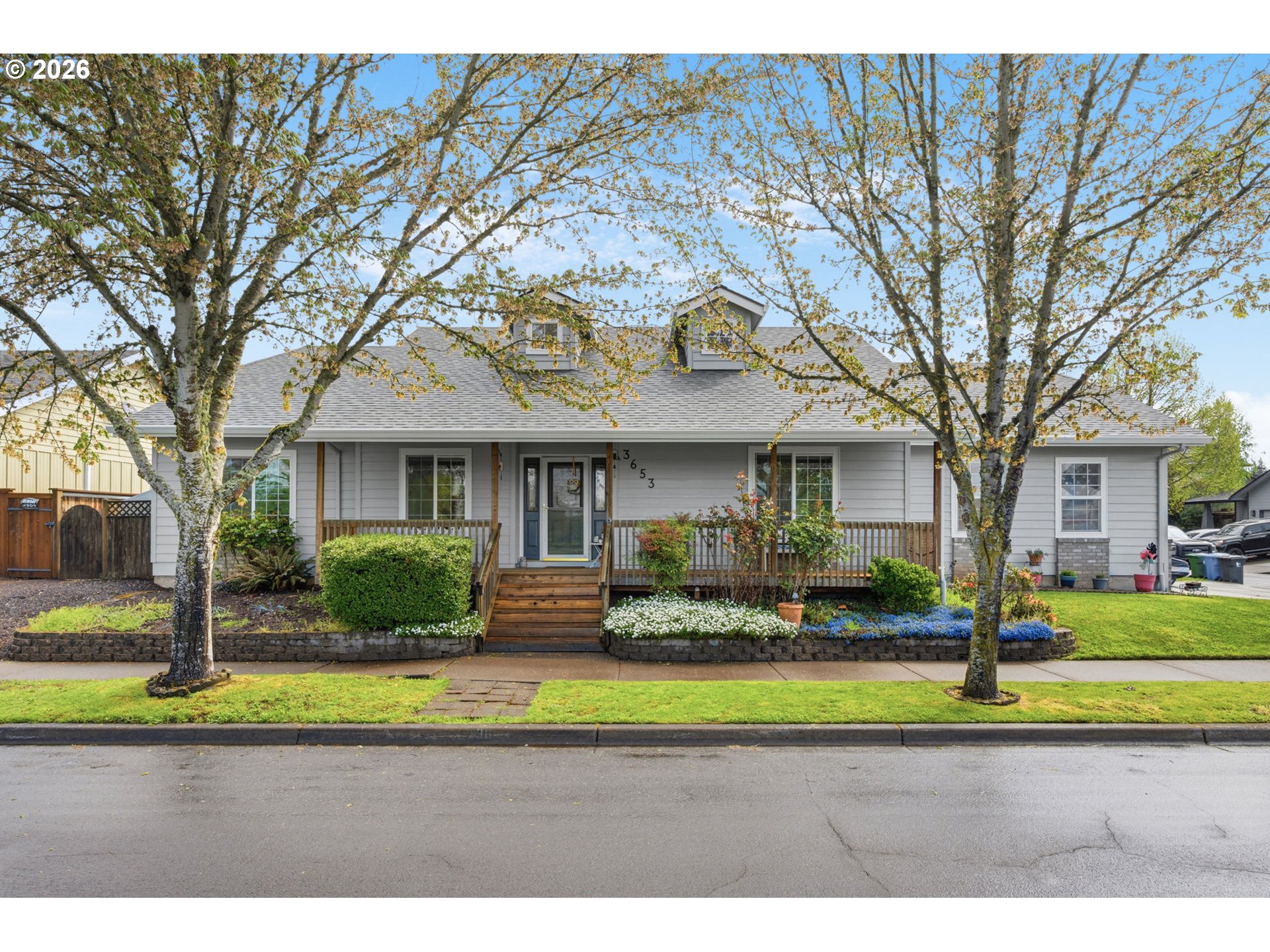3653 Willowbrook Street Eugene, OR 97404 - Photo 1 of 43 a front view of a house with a yard table and chairs