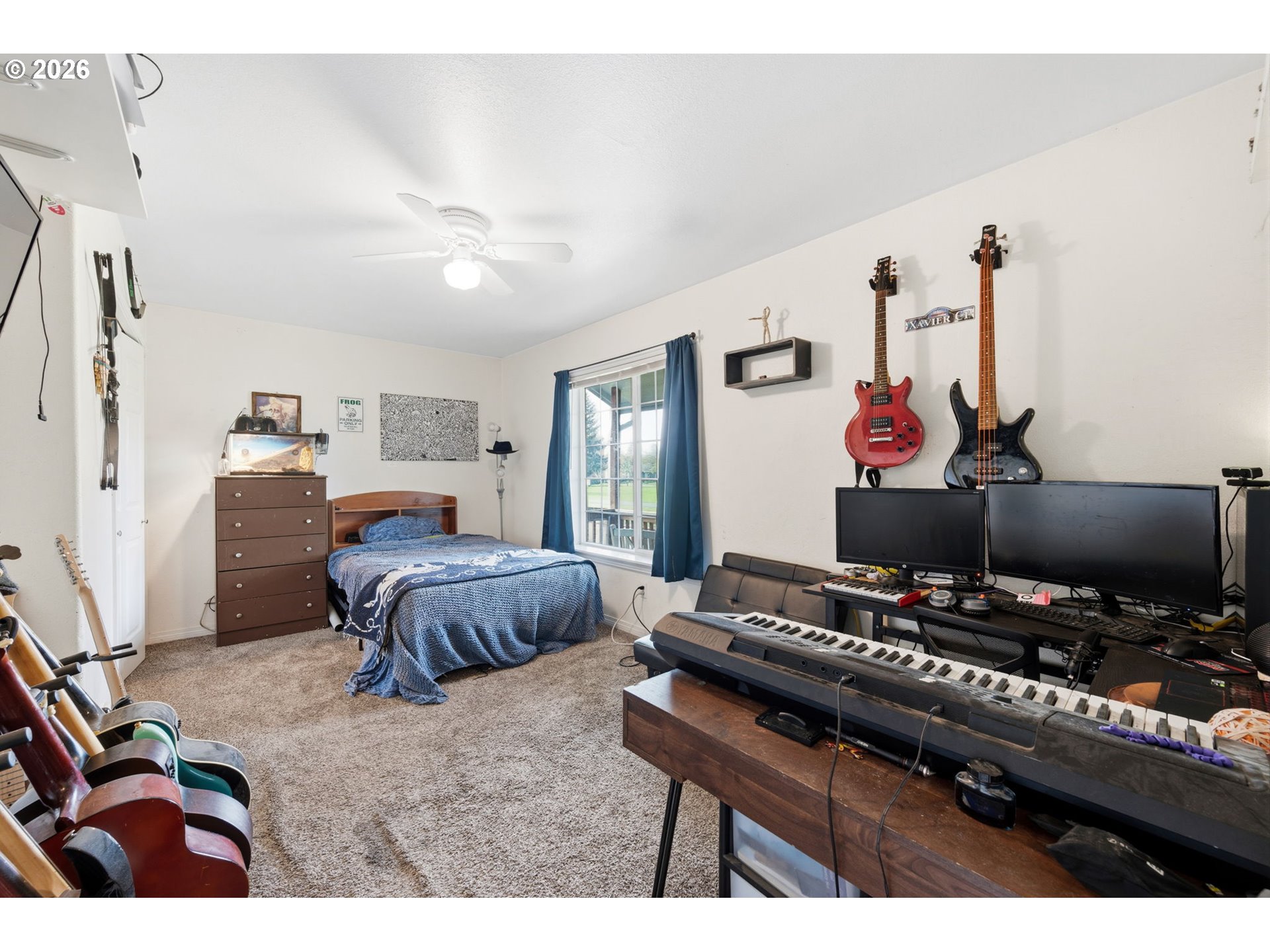 3653 Willowbrook Street Eugene, OR 97404 - Photo 20 of 43 a bedroom with a bed and a flat screen tv