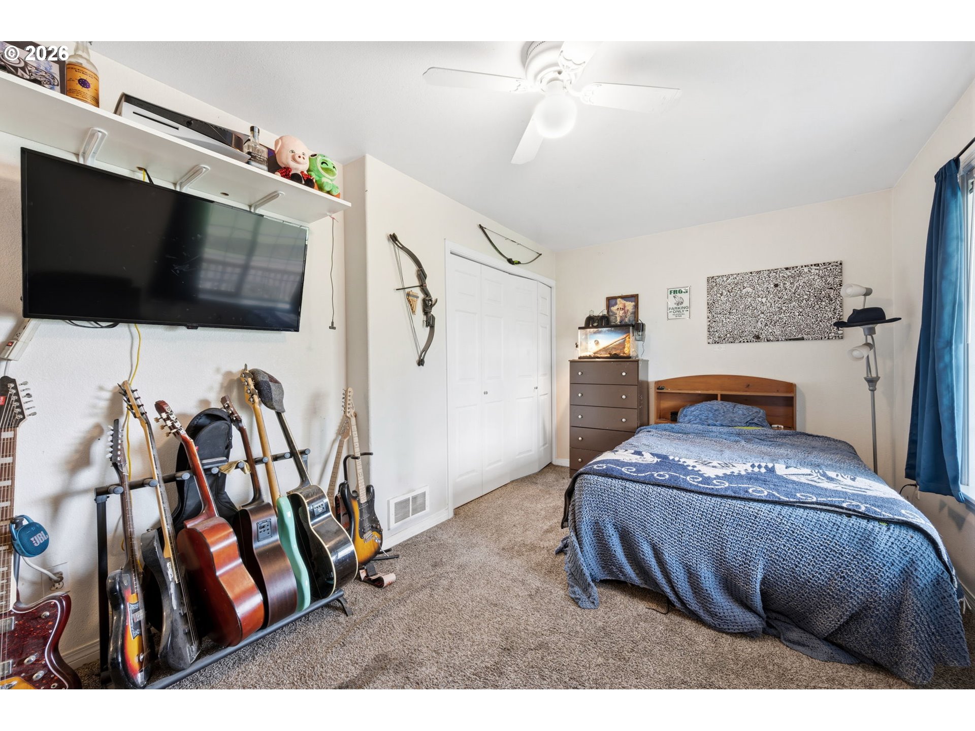 3653 Willowbrook Street Eugene, OR 97404 - Photo 21 of 43 a bedroom with a bed and a flat screen tv