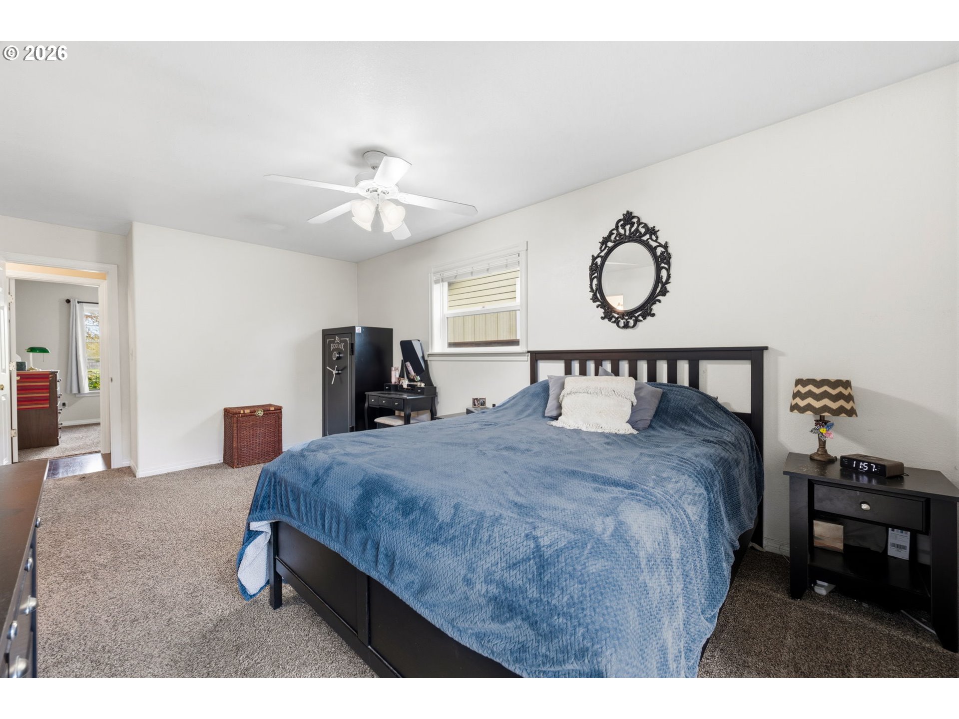 3653 Willowbrook Street Eugene, OR 97404 - Photo 25 of 43 a bedroom with a bed and a chandelier
