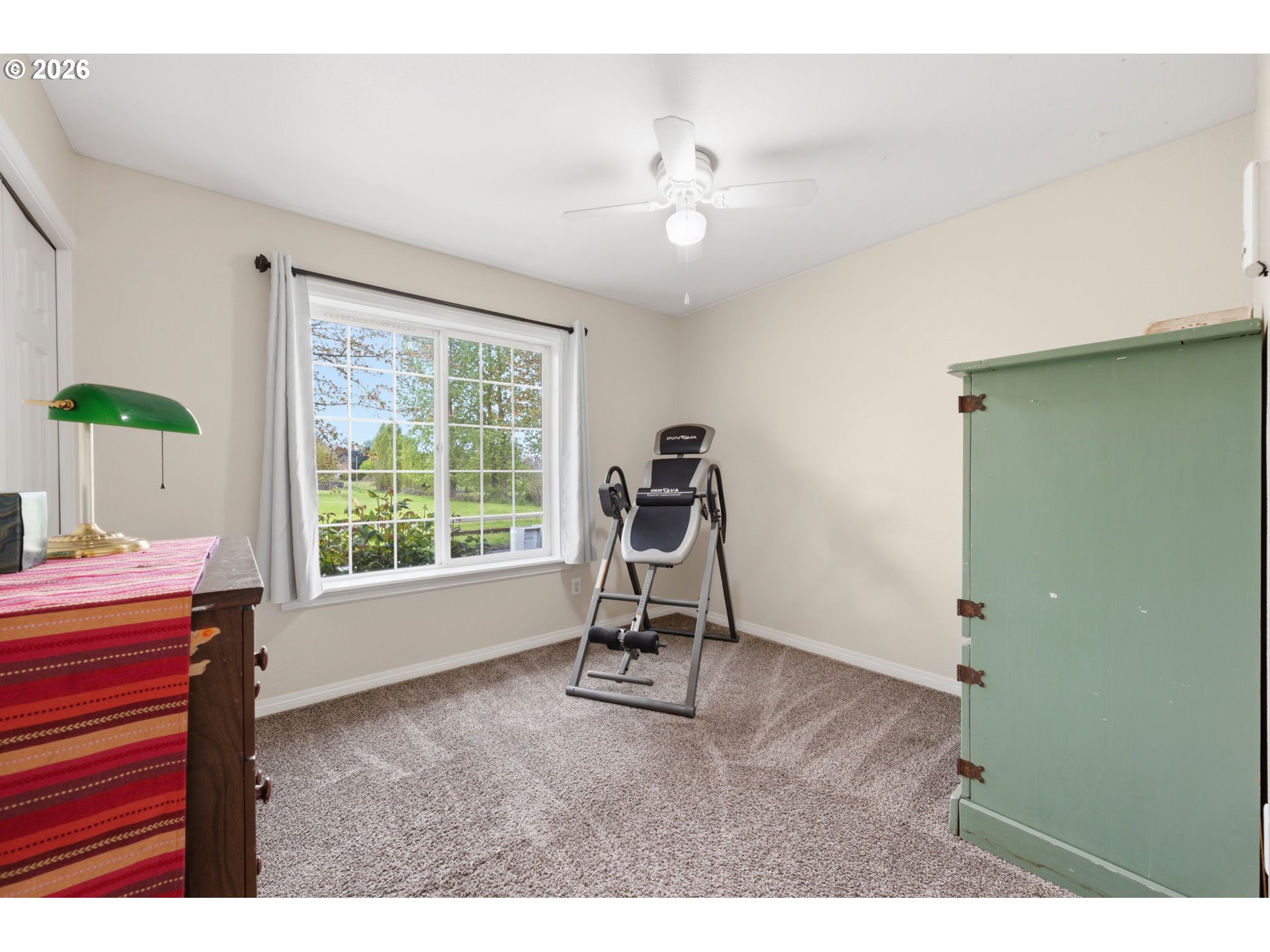 3653 Willowbrook Street Eugene, OR 97404 - Photo 29 of 43 a room with gym equipment and a window