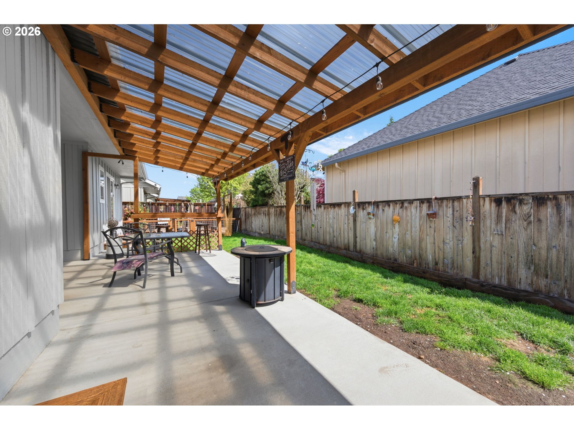 3653 Willowbrook Street Eugene, OR 97404 - Photo 33 of 43 a view of a backyard with sitting area