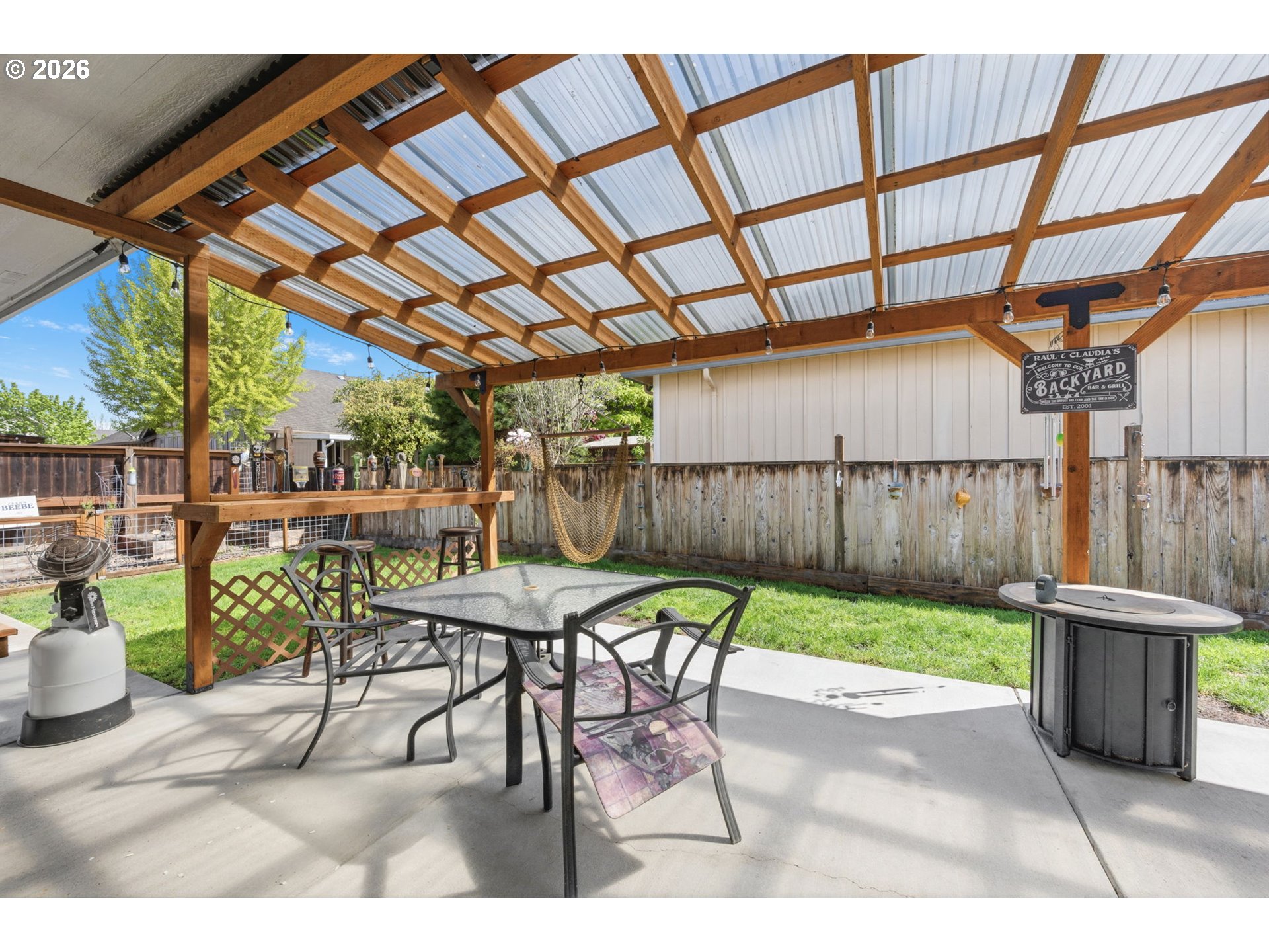 3653 Willowbrook Street Eugene, OR 97404 - Photo 36 of 43 a view of a patio with table and chairs and wooden fence