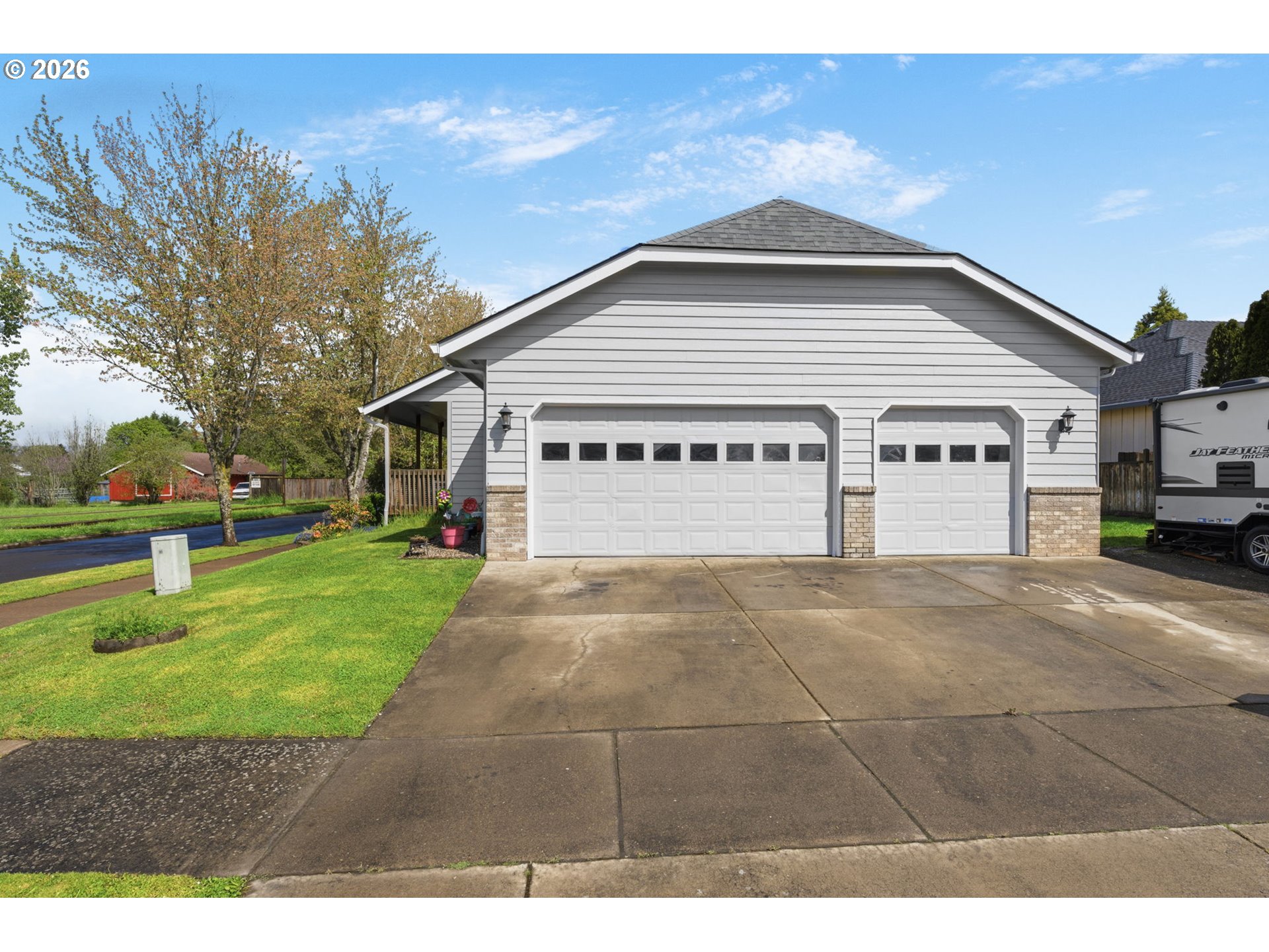 3653 Willowbrook Street Eugene, OR 97404 - Photo 5 of 43 a view of a white house with a yard