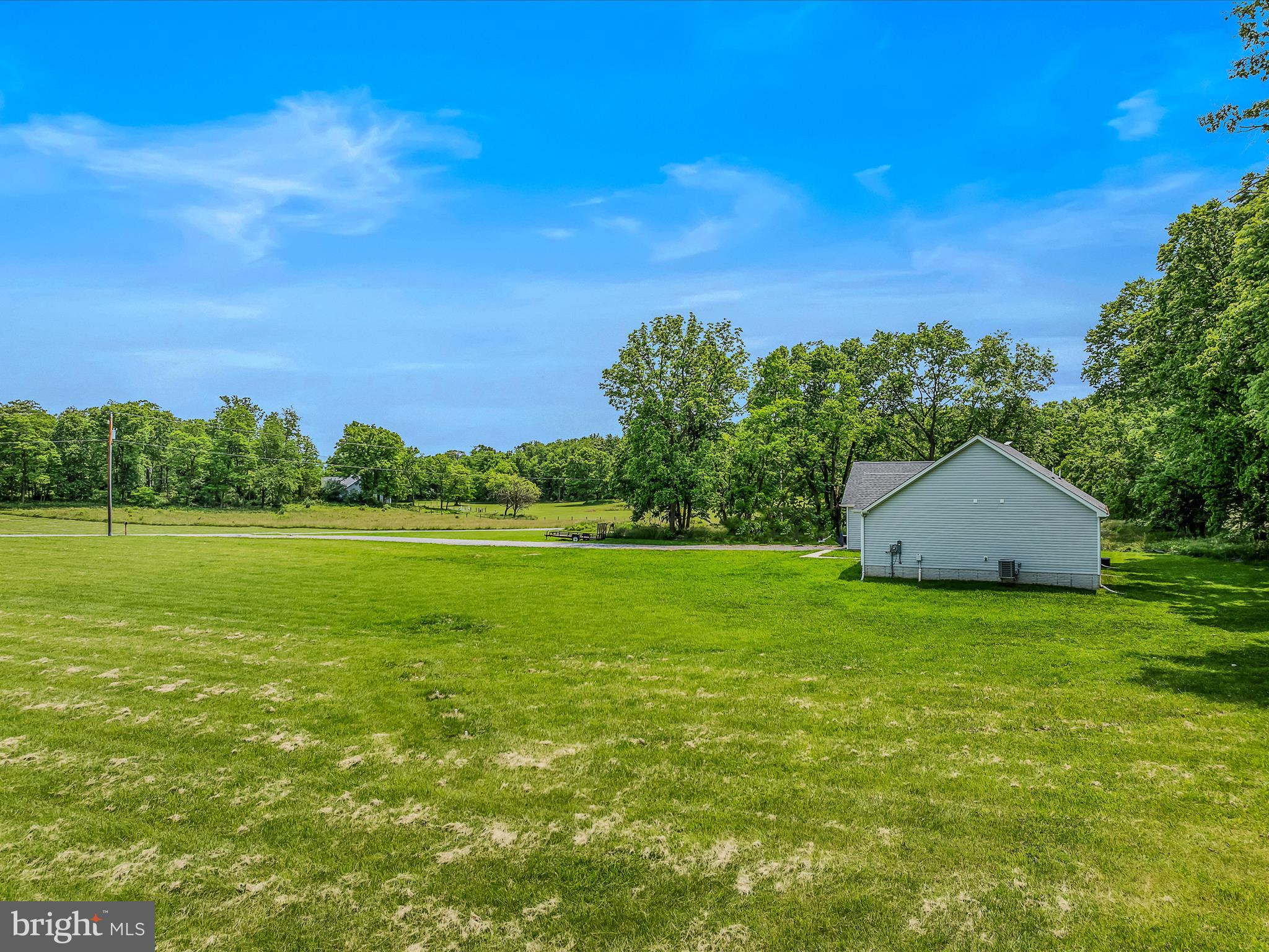 118 Fox Lair Ln Summit Point Summit Point, WV 25446 - Photo 37 of 49 a view of a green field with clear sky