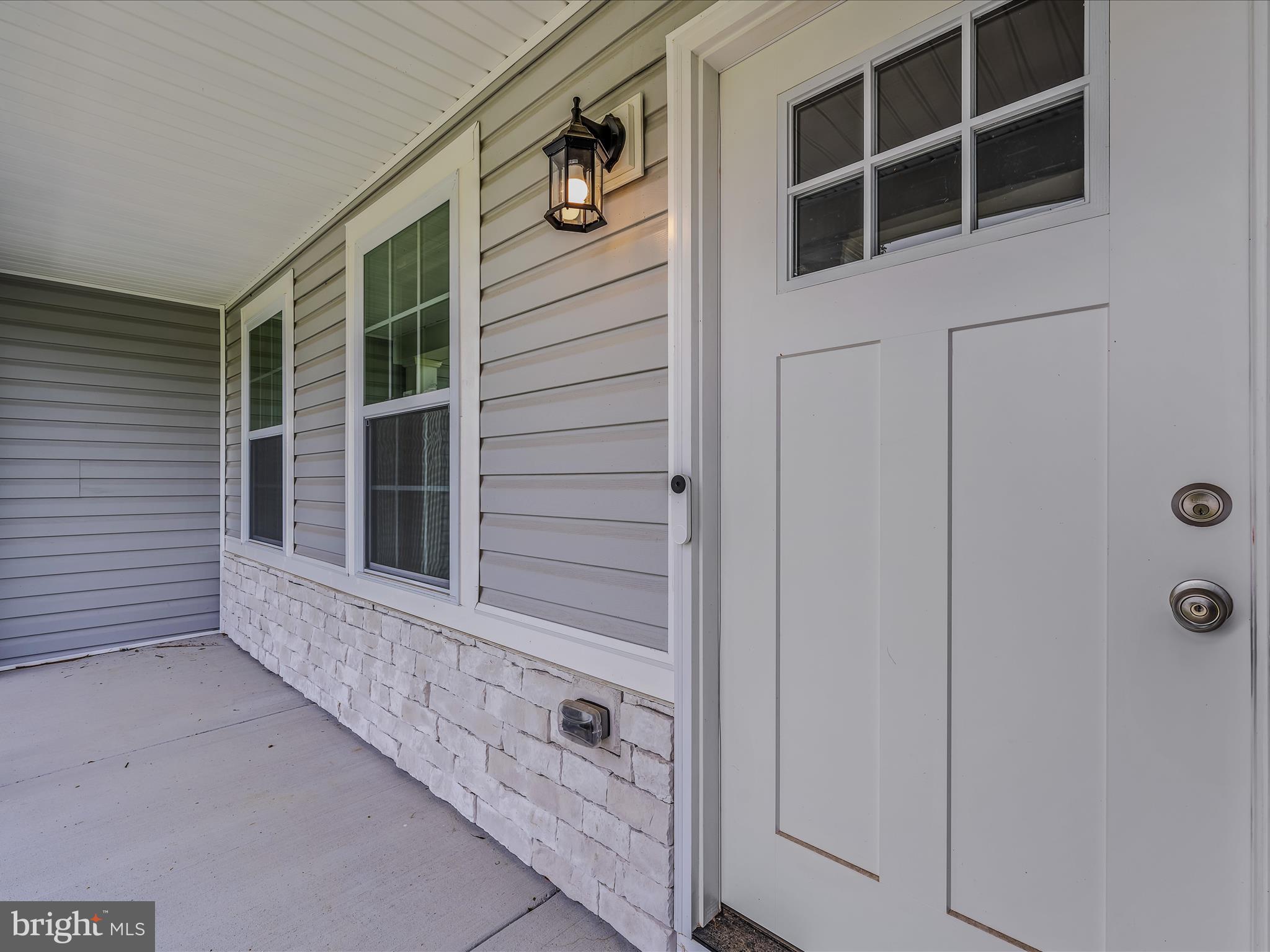 118 Fox Lair Ln Summit Point Summit Point, WV 25446 - Photo 6 of 49 a view of front door of house