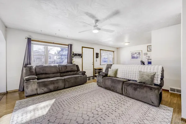 a living room with furniture and a large window
